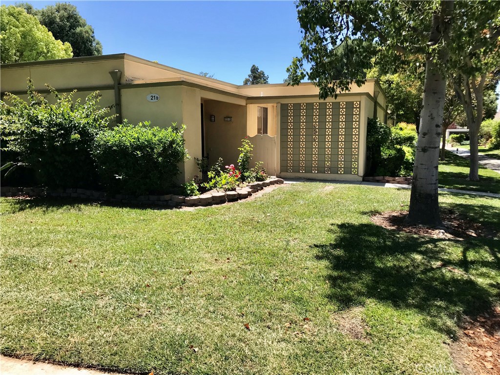 Premier 55 Plus Senior Community. Two-bedroom, two-bath, single-level BARCELONA floor plan. End Unit and No stairs! Situated in a serene private location, this residence sits on a bluff with a sweeping panoramic view of the neighborhood, mature trees, lush greenery and the distant Saddleback mountains. Upgraded interior: kitchen cabinets/counters/appliances, bathroom fixtures, STACKABLE WASHER/DRYER, wall air units in the living room and master bedroom. Interior atrium with accessed via sliding glass doors from the dining area and guest bedroom. Private front patio for your outdoor enjoyment. Enjoy the resort-style amenities of this active Senior Community Laguna Woods Village, featuring 2 golf courses, 7 clubhouses, horseback riding stables, 5 pools, tennis, driving range, sport courts, restaurant, exercise+ studios, transportation system and over 200 clubs.