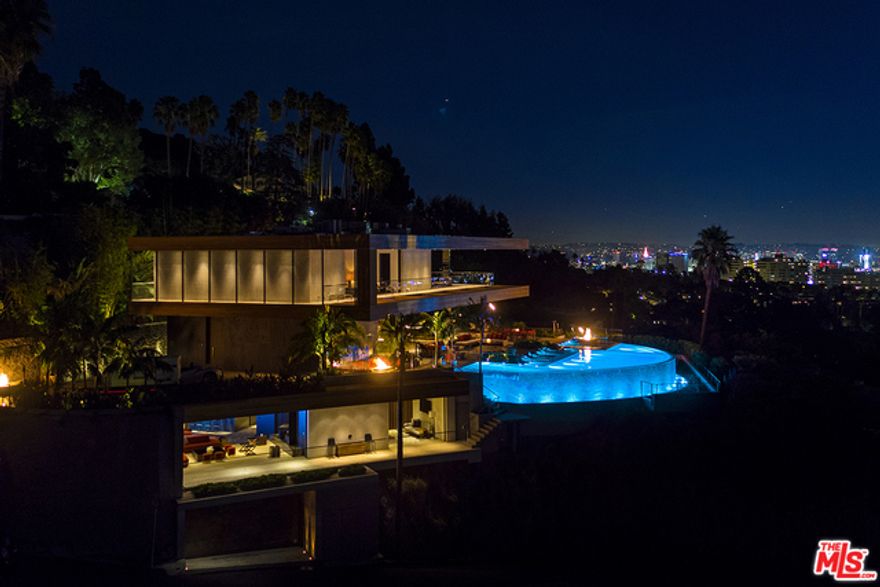 Imagine all the stars aligned and the view gods & rock gods came together to build their last homage to the legendary Sunset Strip. Lautner, Goldstein, Sinatra and Jimi Hendrix would all give their nod to The Stanley House. Perched like an eagle's nest on the #1 promontory view lot in the city hovering just above The City of Angels with the ultimate privacy & explosive 270&#195;&#8218;&#194;&#176; views that you can reach out and kiss. Presenting the most masterful mid-century modern paradise ever constructed. The only budget was there was no budget; everything had to be the best.Architecture from XTEN's Austin Kelly's last swan song and Lenny Kravitz of Kravitz Design as Creative Director & Interiors. Art installation by RETNA. The list goes on and on with the finest customization and, to top it all off, your very own night club "disco Volante" that will take you to space and back. Don't miss this once-in-a-lifetime opportunity this will never happen again here is your chance to own the stairway to heaven.