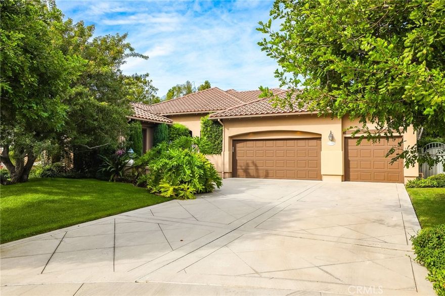 *PRICE IMPROVEMENT*Single Story*Saltwater Pool and Spa*Cul de Sac*Guard Gated Community* Tucked behind the gates of the prestigious 24-hour guarded Madrid community, this exquisite four bedroom three bath single-level residence offers the perfect blend of elegance, comfort, and resort-style living.  A carefully landscaped gated courtyard and graceful archways set the tone as you step inside this beautifully designed home. The open-concept floor plan flows effortlessly, with arched transitions leading from one inviting space to the next. An elevated dining area overlooks the expansive living room and kitchen—ideal for hosting gatherings large or small.  The chef’s kitchen impresses with a grand center island featuring a built-in cooktop, double ovens, a convenient office nook, and French doors that open to an entertainer’s dream backyard. Step outside to enjoy your private oasis complete with a covered gazebo, sparkling saltwater pool, and relaxing spa—perfect for outdoor dining and leisure.  A separate family room with a half bath provides a versatile space for movie nights, a playroom, or even a home studio. The luxurious primary suite is a true retreat, highlighted by a stunning stone fireplace and an adjoining sitting room with built-in shelving—ideal for a home library, office, or fitness area. French doors provide direct access to the backyard, while archways lead to the spa-inspired primary bath featuring dual vanities, a walk-in shower, a soaking tub, and an impressive walk-in closet.  The three generously sized secondary bedrooms, a well-appointed laundry room with abundant storage, and direct access to the three-car garage add everyday convenience. With its blend of sophistication and comfort, this home truly embodies the best of luxury living in one of Tustin’s most coveted communities.  Welcome yourself home to 12215 Wyne Court.