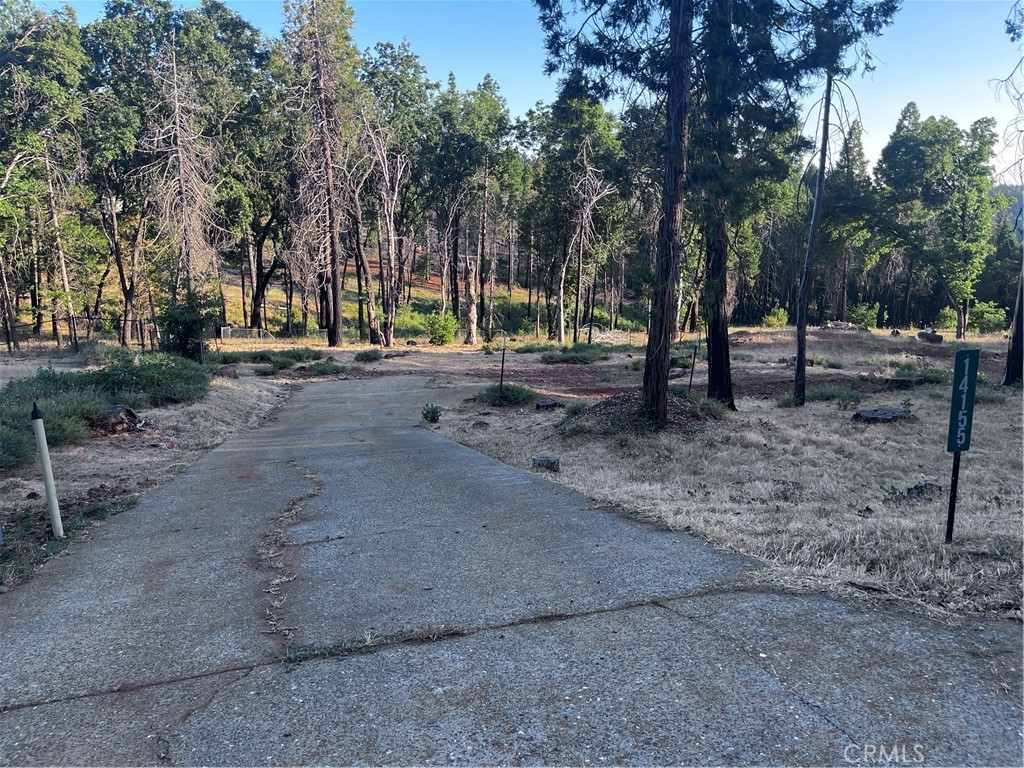 Build Your Dream Home in Paradise Pines!
This beautiful lot offers nearly half an acre of opportunity in an established and desirable neighborhood. Sloped but very manageable, it’s ideal for a spacious custom home while still allowing for a great backyard retreat. The property features a natural spring and direct access to the scenic Ponderosa Trail—perfect for nature lovers and outdoor enthusiasts. Located within the Paradise Pines Property Owners Association, you’ll enjoy a host of amenities including a clubhouse, swimming pool, hot tub, tennis and pickleball courts, basketball court, and horseshoe pits. While the condition of the septic system is unknown, the existing septic tank and leach lines are still intact. All that’s missing is your vision—come make this property your own!