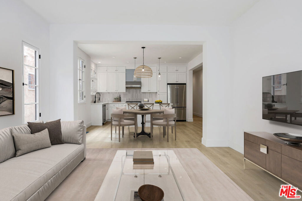 Welcome to a stunning, newly renovated upper-level three-bed, three-bath gem that truly feels like an upscale home with high-end finishes. The spacious open floor plan is beautifully accented by oversized windows for floods of natural light and grand archways for a gracious flow through all spaces. The sleek and stylish kitchen has everything for the modern lifestyle including stainless-steel appliances, elegant tile backsplash, ample cabinetry, and center island with breakfast bar. All bedrooms are well-appointed with efficient storage space, picture windows, and stunning updated baths. Additional features include in-unit washer/dryer, central A/C, parking, and more. Located in the heart of beloved Miracle Mile, this picturesque home is just moments to local shops, restaurants, entertainment, LACMA, and The Grove! Some photos are virtually staged.
