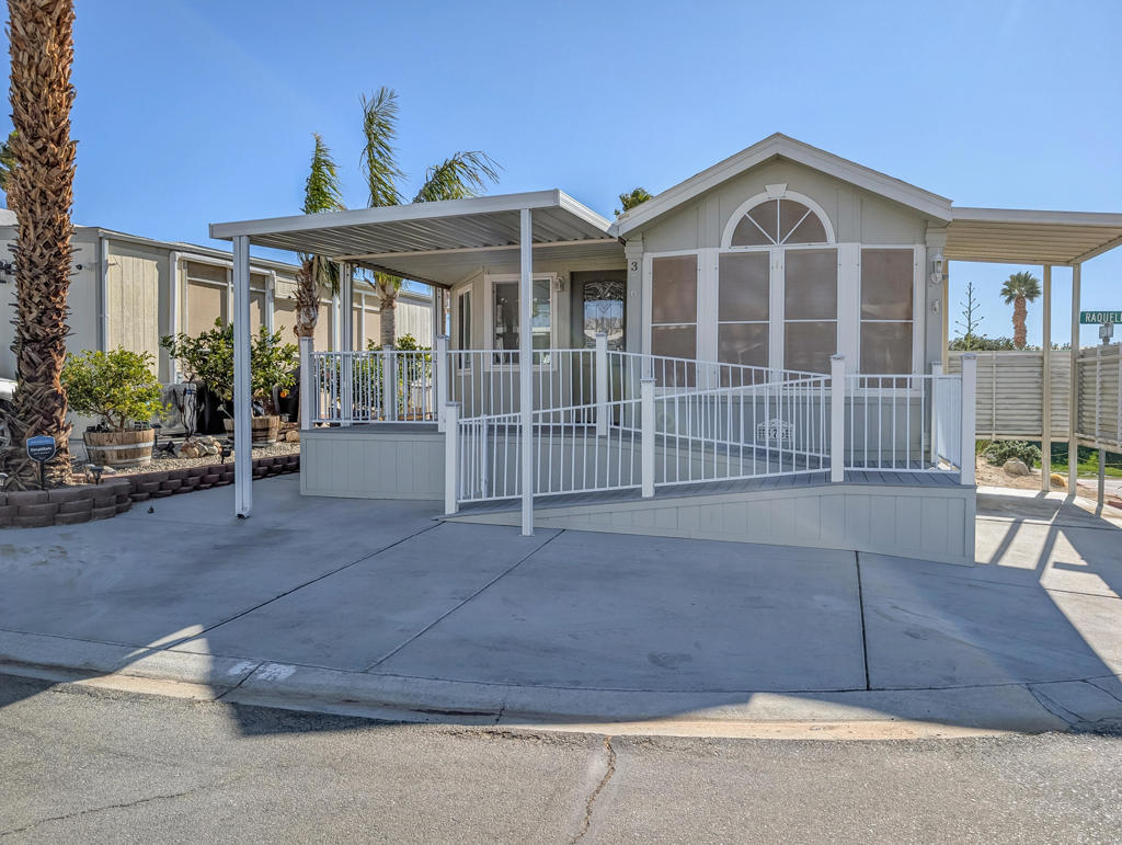 Nestled near the clubhouse and centrally located within the community hub, this delightful and meticulously maintained 1-bedroom, 1-bathroom 1996 Fleetwood Park Model offers approximately 800 square feet of comfortable living space. The home stands out for its thoughtful layout and appealing features, making it a perfect choice for those seeking both convenience and comfort in a vibrant resort setting. This stick-built residence offers the flexibility of adding a second bedroom, providing extra space for guests or hobbies. The kitchen is equipped with elegant granite countertops, while upgraded hardwood flooring runs throughout the home, enhancing its warmth and appeal. For added convenience, there is a private laundry room with washer and dryer hookups, a utility sink, and both ductless and standard HVAC systems for efficient heating and cooling. The jack & jill bathroom ensures easy access from multiple rooms, maximizing functionality. Step outside to a private, covered deck accessed via a ramp, offering a comfortable spot to relax and take in the picturesque views of the surrounding desert hills and mountains. The back of the property faces the first hole tee of the golf course, providing a tranquil and scenic backdrop. while proximity to sports courts and the driving range offers ample opportunities for recreation. Located within the luxurious 55+ Caliente Springs Resort, residents enjoy access to a wide array of amenities including a mineral hot spring pool and spas, a fitness center, a 9-hole golf course, pickleball courts, tennis courts, and a calendar full of organized community events designed for fun and social connection. This home is ideal as a primary residence or a relaxing getaway. Please note that the lot is not owned; the current space rent is $811.