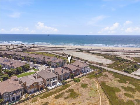 Photo of 5571 Ocean Terrace Drive, Huntington Beach, CA 92648 (MLS # OC26140181)