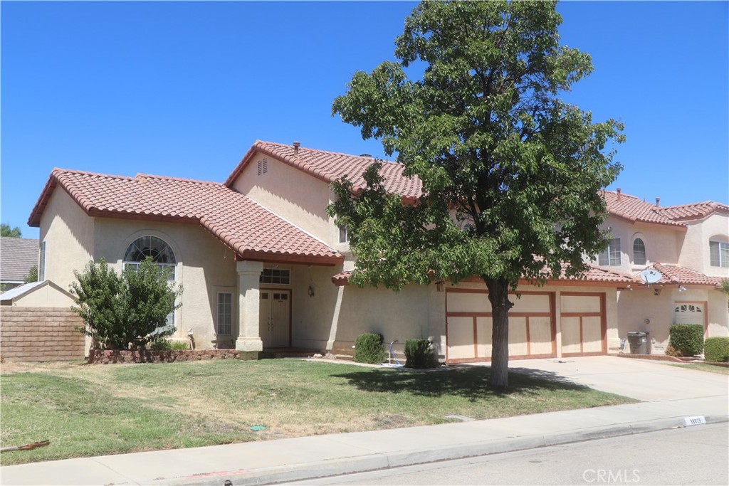 Beautiful West Palmdale Home in a Highly Desirable Neighborhood! This well-maintained Westside home truly has it all! Featuring 4 bedrooms — 3 upstairs and 1 conveniently located downstairs next to a full bathroom — it offers both comfort and flexibility for any lifestyle. The spacious layout includes an indoor laundry room and a 3-car garage. Recent upgrades include a newer AC and heating unit, and the entire tile roof was removed and resheeted just two years ago for peace of mind. The kitchen has been tastefully updated with oak cabinetry, countertops, and a stainless steel sink. The backyard offers a pool-sized lot, perfect for entertaining, and even includes your very own built-in pizza oven! Seller is very motivated! They've already purchased and moved into their new home and are ready to make a deal. Located close to shopping, dining, and top schools, this home checks all the boxes. Don't miss out — this gem won't last long!