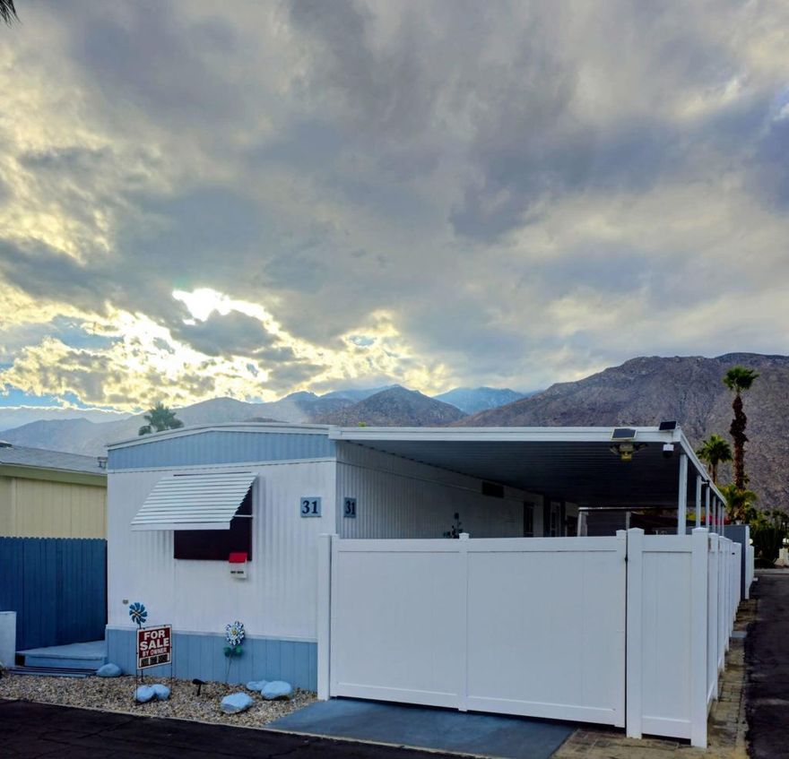 Location. Privacy. Palm Springs Lifestyle.Welcome to 31 Blackhawk Street, located in the historic Ramon Mobile Home Park--one of Palm Springs' original mid-century communities, developed in 1938 by John Williams. Once a desert retreat for Hollywood creatives, Ramon Park continues to capture the vintage charm and iconic appeal that define Palm Springs living.Situated in the desirable Warm Sands area, this home offers exceptional privacy on a rare oversized lot with off-street parking and no shared walls. Just minutes from the Ralphs Shopping Center, less than one mile from downtown Palm Springs, and approximately three miles from Palm Springs International Airport, the location is ideal for both full-time living and seasonal escapes.This newly remodeled 600+ sq. ft. 1979 Fleetwood Crownpoint home features 1 bedroom and 1 bathroom with a bright, open floor plan. Recent updates include wood plank flooring throughout, freshly painted interior, new kitchen cabinets, updated kitchen and bathroom countertops, a remodeled shower, and a new hot water heater. The home is equipped with central air conditioning and heating, a newer refrigerator, microwave, gas stove and oven, plus a washer and dryer. Good size walk-in closet also. The property may be sold furnished, if desired.Enjoy outdoor living with a newly installed white vinyl fenced yard, fully secured with two gates, along with a covered carport and a 16' x 6' storage shed with washer/dryer hookups.Ramon Mobile Home Park is an active 55+ community offering outstanding amenities, including a swimming pool, spa, clubhouse, fitness center, library, and shuffleboard courts. This lifestyle provides a more affordable alternative to a condo while offering the freedom to personalize your indoor and outdoor space.Perfect as a vacation getaway or year-round residence.Monthly land lease: $900. Purchase subject to park management approval.