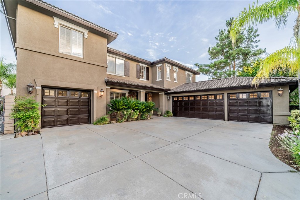 Prestigious South Corona Exectutive Home surrounded by Multi-Million Dollar Home and Cleveland National Forrest. Homes rarely come available in the Neighborhood. This 6 bedroom, 4 full bath, with a 4 car garage floor plan features a Formal living room, Formal Dining room, and Super-sized Open Family room Kitchen. Fireplace with hearth. Kitchen with Granite Island, Pantry and Built in appliances. Butler pantry area between the Kitchen and Foraml Dining room. Kitchen has direct access to one car garage. Downstairs bedroom and bath. Downstairs Hallway leads to attached 3 car garage. New Epoxy floor in garage. Upstairs turning stairs lead to first two bedrooms with a jack and jill bath. Then a big laundry room. Continue down winding hall to two more spacious bedrooms and another Hall bath. Large Master bedroom Suite with Huge Master closet. Long vanity with double sinks, Large shower and jacuzzi tub. Outside RV Parking, Covered Patio, Stamped concrete, firepit, BBQ Island. No houses behing this home. Beatiful rolling hills and City Views. No HOA. No Mellow Roos. Award Winning Schools!!!
