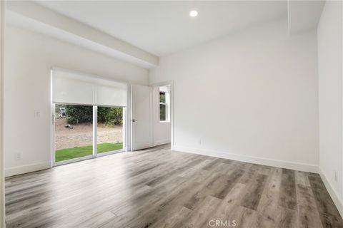 Photo of 821 Melody Lane, Lytle Creek, CA 92358 (MLS # CV26095793)