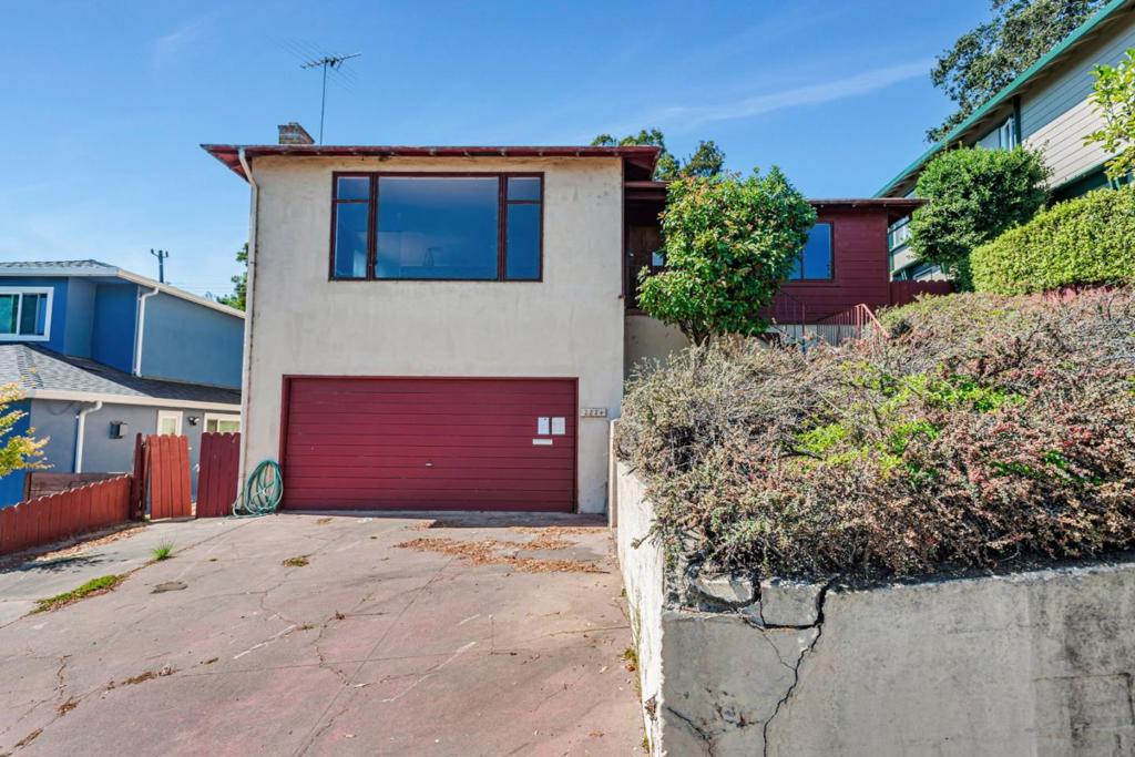 Welcome to this charming 3-bedroom, 2-bathroom home located in the vibrant city of San Mateo. This home needs your TLC.. This property offers a comfortable living space of 1,500 square feet nestled on a generous lot of approximately 5,030 square feet. The kitchen is equipped with a gas cooktop and Formica countertops, making it a functional and inviting space for culinary enthusiasts. The dining area is conveniently situated within the living room, providing a cozy setting for meals without the need for a formal dining room. The home features hardwood and vinyl/linoleum flooring throughout, adding to its appeal. Enjoy the warmth of the fireplace during cooler evenings, and take advantage of the electricity hookup (220V) for laundry needs. The residence is part of the San Mateo-Foster City Elementary School District. With a primary bedroom on the ground floor and a primary suite/retreat, this home offers comfort and convenience. The fenced backyard is across from the golf course. The property also includes a spacious 2-car garage.