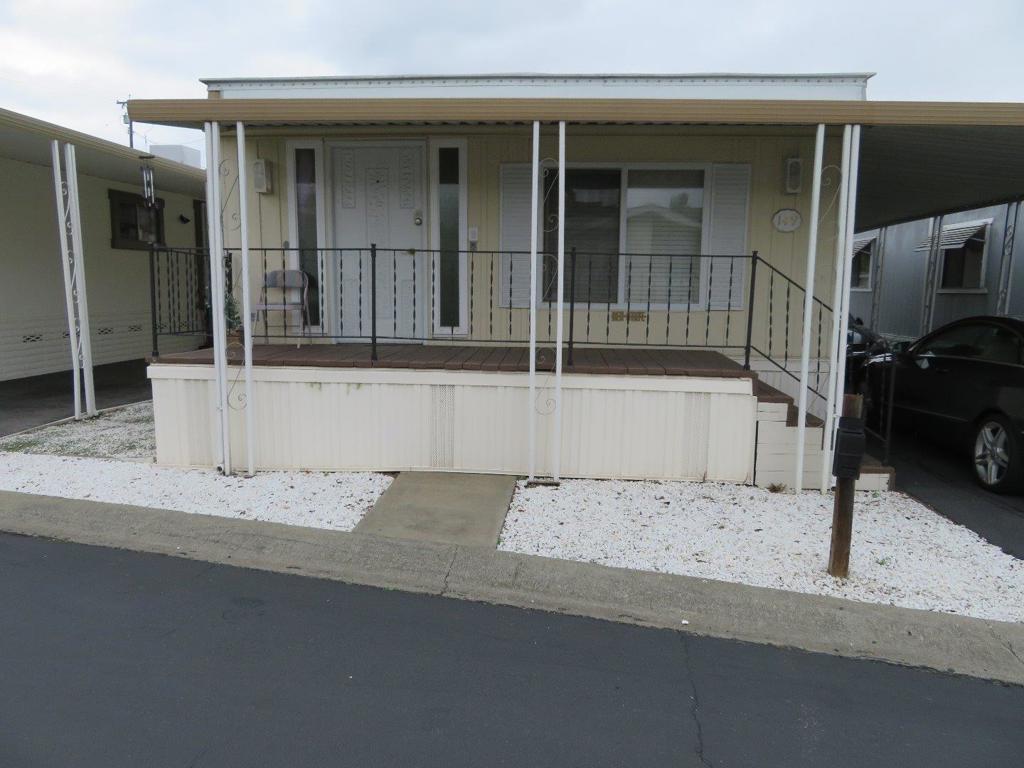 Comfortable Cozy living ! Kitchen and bath some remodeling newer appliances lighter floors and walls Stacking washer and dryer built in hutch private brick patio shed landscaping all around low maintenance nice senior 55 community additional occupant can be 45 close to shops bus rail within walking distance