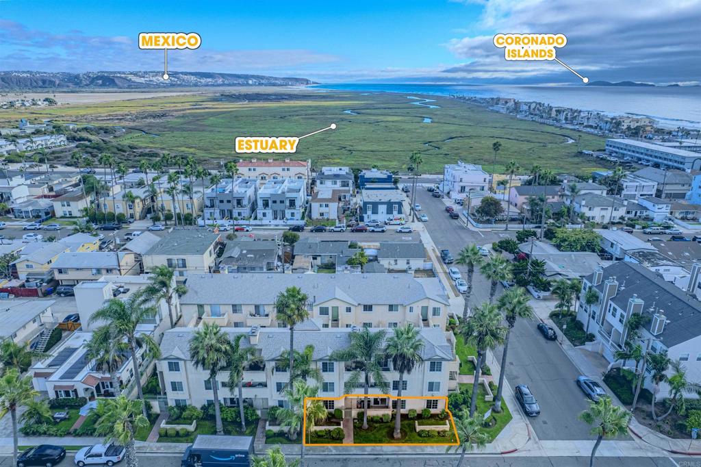 Welcome to life at the beach in this 3-bedroom, 1-level condo on the 1st-floor, nestled just 1-block from the majestic Pacific Ocean and 1-block to the renowned estuary reserve. This light-filled corner unit with newer central AC provides unparalleled access to nature's wonders. Enjoy sun-drenched mornings and vibrant sunsets from your spacious covered patio, use the private gate to gain swift access to the beach, indulging in seaside serenity has seldom been easier. Step inside to discover the epitome of coastal chic, with wood plank tile floors and recessed lighting accentuating the airy ambiance. The upgraded kitchen boasts stainless steel appliances, complemented by pristine bathrooms for a touch of luxury. This condo comes complete with two assigned parking spaces, one in the covered garage. Minutes to downtown Imperial Beach, the iconic pier, and an array of dining and entertainment options just a short stroll away, every day feels like a vacation. This is your opportunity to make coastal living a reality!