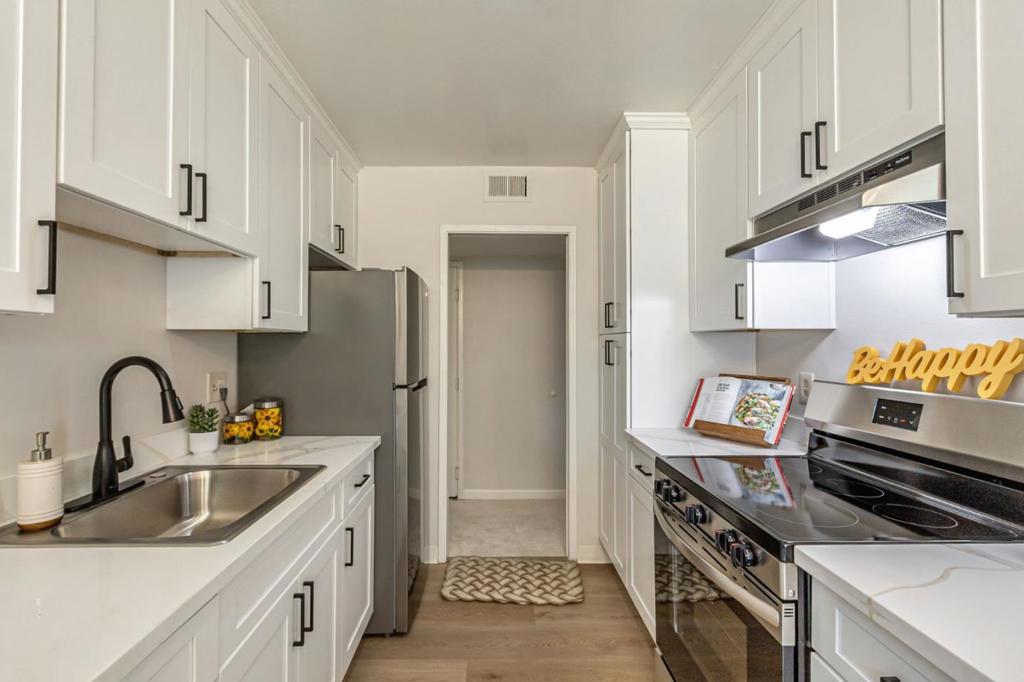 Step into this beautifully renovated top floor 2-bedroom, 1-bathroom condo in the heart of Mountain View. Located in a secure building, Unit 307 has been updated from top to bottom, featuring brand-new kitchen and appliances, baseboards, freshly painted walls and ceilings, LVP floors and new carpet, an remodeled bathroom vanity and modern fixtures throughout creating a bright, move-in-ready space. Inside, you'll find 1,008 square feet of thoughtfully designed living filled with natural light, enhanced by energy-efficient Low-E windows. The spacious living room flows into a dedicated dining area and opens to a peaceful balcony, ideal for morning coffee or relaxing evenings. The kitchen boasts sleek cabinetry, quartz countertops, refrigerator and a modern electric range. Residents enjoy community amenities including a sparkling in-ground pool, convenient laundry, and gated, assigned parking. The HOA fee covers all major utilities!! Electricity, sewer, and water. Located within the acclaimed Los Altos Elementary and Mountain View / Los Altos High School Districts, this condo combines modern comfort with access to top-tier education. Dont miss this turnkey opportunity in a prime Silicon Valley location!