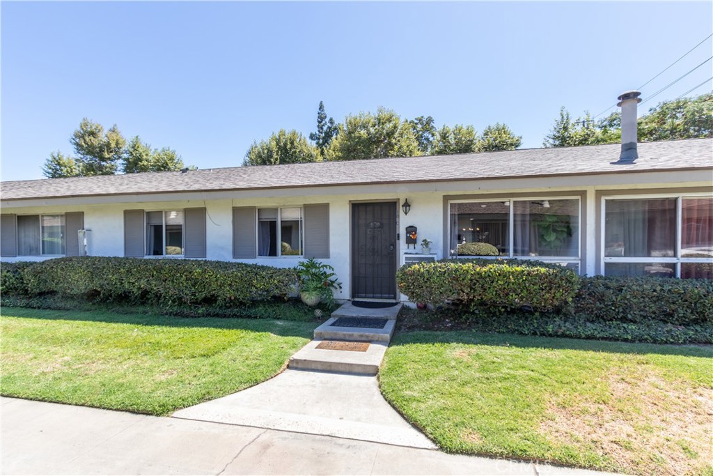 Immaculate, superbly maintained Sycamore Gardens condo! You will be captivated the moment you enter this single level, 3 BR, 2 Bath home that has been totally updated to perfection. Light & bright, open floorplan w/fabulous PORCELAIN flooring & PLASTERED walls throughout. The spacious LR features a lighted ceiling fan & recessed lighting. Adjacent Dining Area is accented by an attractive chandelier & 3-stool Breakfast Bar opening to the Kitchen. The chef of the home will love the stylish, newly updated Kitchen complete w/stainless steel microwave, dishwasher & quartz countertops w/stunning black cabinetry. Primary BR w/a walk-in closet with shelving & drawers, also offers a lighted ceiling fan & a private 3/4 bath w/white cabinetry accented by black quartz countertop & porcelain shower. The 2 nicely sized secondary BRs both have closet organizers, as well as lighted ceiling fans & recessed lighting. Main 3/4 bath features double sinks and gleaming porcelain shower area. Two hallway closets for storage + pull-down attic access. Outdoor covered laundry area (approved by HOA) with ample storage + a relaxing outdoor brick accented patio. Wall AC unit in LR/DR area. One assigned carport with locked storage cabinet. Association Pool, Hot Tub & Gazebo in greenbelt area. Assoc. also covers water, trash, roof maintenance & landscaping. HOA replaced the roof only 2 years ago and Sellers recently re-piped the home. Move-in ready!!