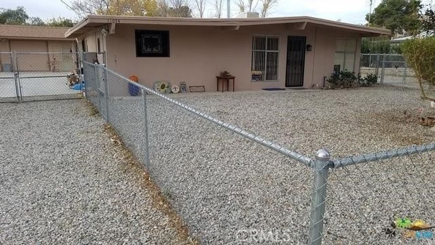 Welcome to peaceful Morongo Valley—where retro charm meets modern comfort.



This bright, beautifully maintained mid-century home is move-in ready and full of character. Step inside to find a light-filled living room with dramatic 1950s-style beamed ceilings and striking floor-to-ceiling corner windows that flood the space with natural light.



The open-concept kitchen has been updated and features a skylight, ceiling fan, and recessed nook that’s large enough for a dining table. There's also another floor-to-ceiling window, bringing in even more brightness and a spacious feel.



Off the kitchen, you'll find a generous bonus room—originally the carport—perfect for a home office, studio, or creative space. (Please note: this additional room is not included in the stated 800 sq ft.)



Both bedrooms feature the same eye-catching beamed ceilings and clean architectural lines, staying true to the home’s retro roots. Out back, enjoy a covered concrete porch with a built-in bench and laundry area.



The oversized detached two-car garage provides ample storage or workspace, while a covered parking area accommodates at least three additional vehicles. 



Whether you're seeking a stylish desert getaway or a peaceful full-time residence, this one is worth a closer look.