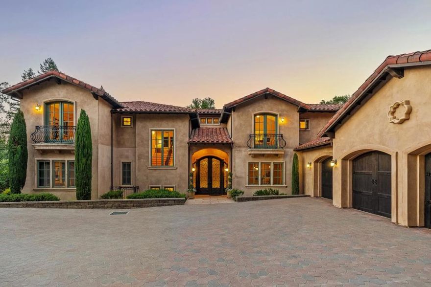 Nestled in the serene hills of Los Altos Hills, 11860 Francemont Drive is a Tuscan-inspired estate blending privacy, elegance, and modern luxury. Situated on a 40,000 sq. ft. wooded lot (per County) with 5,540 sq. ft. of living space (per Appraiser), this 7-bed, 6-bath home showcases fine craftsmanship - coffered ceilings, alder doors, hardwood floors, and three fireplaces. The gourmet kitchen features high-end appliances and a large island, opening to a grand family room with soaring ceilings and picture windows framing panoramic views. Upstairs includes four spacious bedrooms, including a luxurious primary suite with spa-like bath and private balcony, plus a flex space ideal for an office or lounge. Downstairs offers two bedrooms, 2.5 baths, a gym, sauna, and a multipurpose space for a home theater or guest suite, all with abundant natural light. Outdoors, enjoy patios, lush gardens, and mature trees - perfect for relaxing or entertaining. Additional features: 3-car garage, 2 laundry rooms, built-in sound, and proximity to Hwy 280, Stanford, Sand Hill Rd, top schools, trails, and Downtown Los Altos. A rare opportunity to own a timeless estate that embodies refined Silicon Valley living.