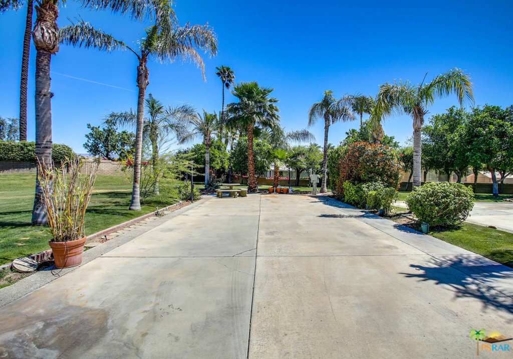 Nice corner lot much bigger than most with large greenbelt and no one to the north of you. This lot is extra deep and would accommodate the largest of RV's. Landscaped nice and so very private. Outdoor Resort Palm Springs is a 5-Star RV Resort and Country Club. We feature 1,213 sites with metered 50-amp electric service, water, sewer and cable services. The guard gated resort sits on 137 beautifully landscaped acres with 27 holes of executive golf, 10 tennis courts, 13 pickleball courts, 8 swimming pools, a fully equipped fitness center, espresso bar, beauty salon/barber shop, full-service restaurant, convenience store, two club houses, activities, special events and more. Water, sewer, daily trash pickup, landscaping of all grass, unlimited golf, tennis, pickleball, instructions, 8 pools, activities and clubs are all included w/ your dues of $394.00.