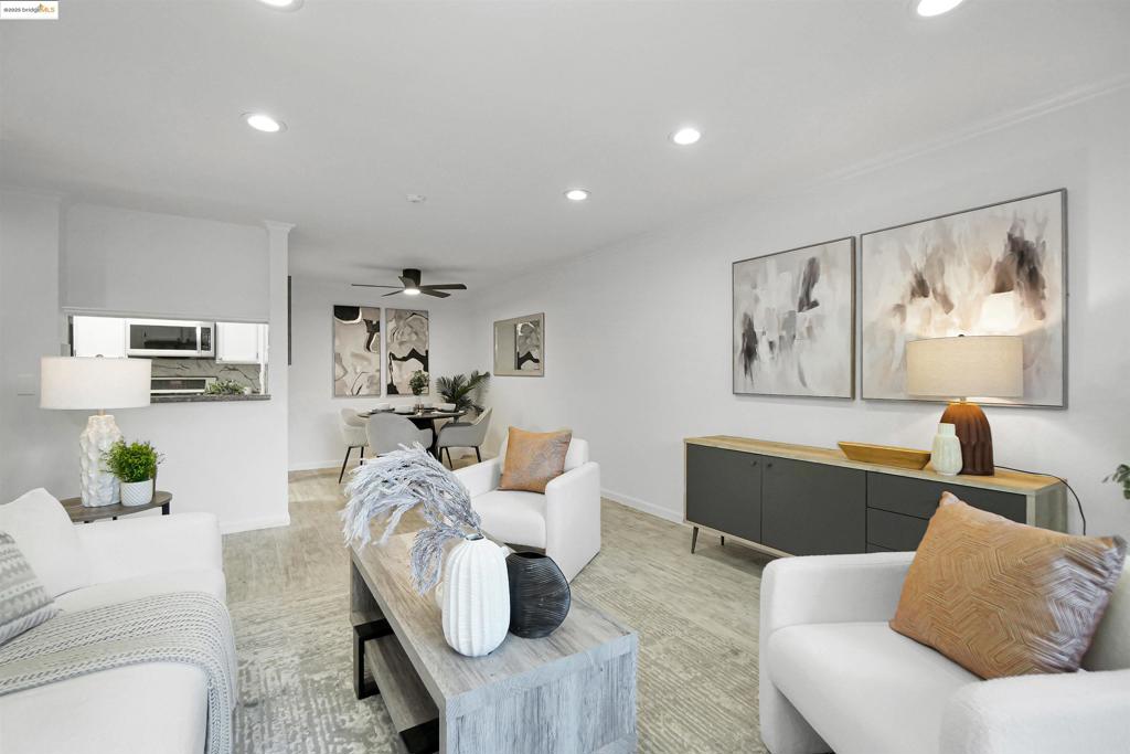 Beautifully Refreshed Corner Unit in Prime Newark Location! Welcome to 39821 Cedar Blvd Unit 111—a move-in-ready corner unit offering extra privacy, abundant natural light, and stylish updates throughout. This ground-floor condo features a freshly updated interior with new paint, modern flooring, and clean contemporary touches. The bright, open living area includes a built-in cabinet for convenient storage or elegant display, and it opens directly to your own private patio—perfect for enjoying quiet mornings or relaxing evenings outdoors. The galley-style kitchen is well-maintained with stainless steel appliances, ample cabinetry, and a functional layout that makes meal prep easy. The spacious primary bedroom is enhanced with an AC extension for added year-round comfort—a rare and valuable upgrade in the community. Both bedrooms are generously sized and offer flexibility for family, guests, or a home office. As a corner unit, this home enjoys extra privacy and natural light. The community is full of beautiful greenbelt areas and this unit is conveniently close to the sparkling pool, making it easy to enjoy sunny California days. Plus, the location makes it easy to walk to nearby shops, restaurants, and everything you need around town. Don