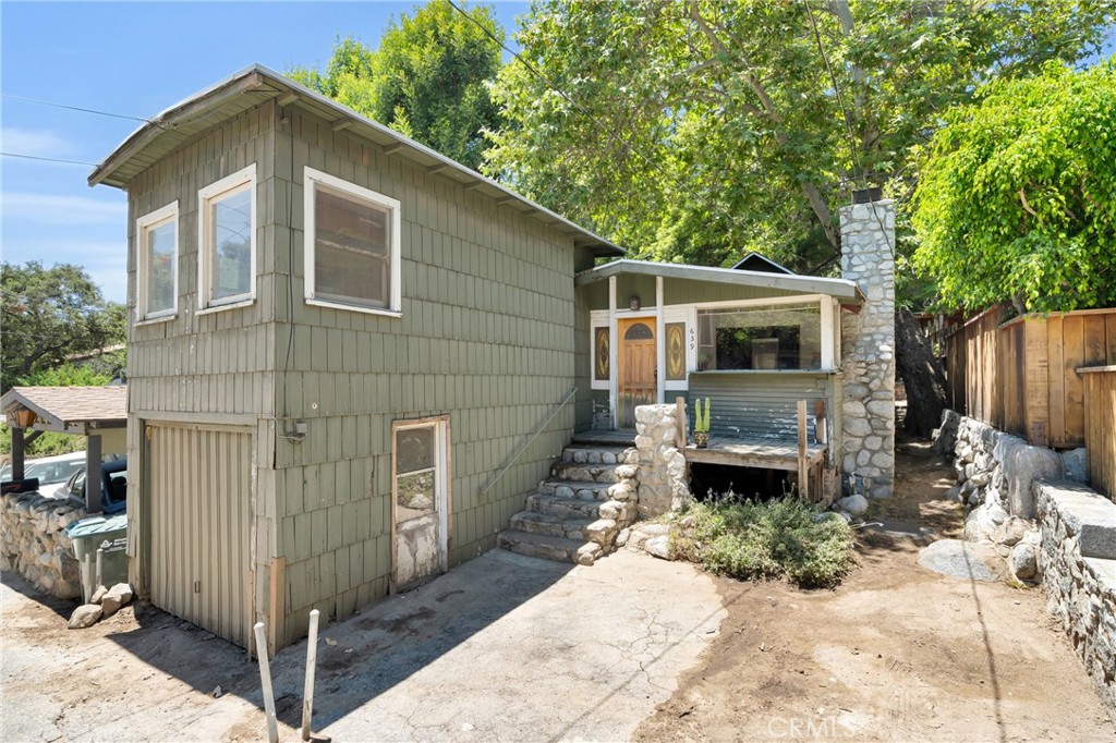 Price Reduction! Don’t miss this rare chance to restore, remodel, or reimagine a hidden gem nestled in the heart of Sierra Madre Canyon. Built in 1918, this enchanting single-family home offers a peaceful retreat surrounded by nature, just minutes from downtown Sierra Madre and a short drive to all that Pasadena has to offer. Set on a secluded lot backing to a tranquil brook and just up the hill from the beloved Mary’s Market, this quaint home features 2 beds, 2 baths, original stained glass windows, large living room with working wood fireplace, dining area, eat-in kitchen, spacious closets, and an indoor laundry area. The backyard provides direct access to the brook, offering serene views and a one-of-a-kind setting. Whether you're looking to fix and flip or create your dream canyon retreat, this property is brimming with potential. Sold AS-IS, it’s perfect for investors, flippers, or creative buyers ready to bring their vision to life. Buyer to conduct their own due diligence and verify all property details and conditions.