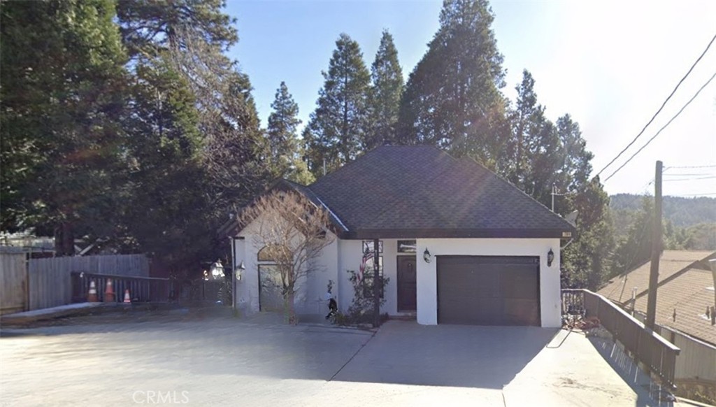 Stunning 3 bed 2.5 bath custom-built home built in 2005! The main floor features an open floor plan with living room, kitchen, dining area, half bath, and access to a spacious deck. The primary suite is also on the main level, complete with a luxurious bathroom featuring a jetted tub and separate shower. The lower level offers a generous family room with a wet bar, two additional bedrooms, a full bathroom with dual sinks, and direct access to the fully fenced backyard. The yard includes a lush lawn with sprinkler system. Exterior is finished in durable stucco. This home has ample parking including space for an RV, and a fully insulated single-car garage.