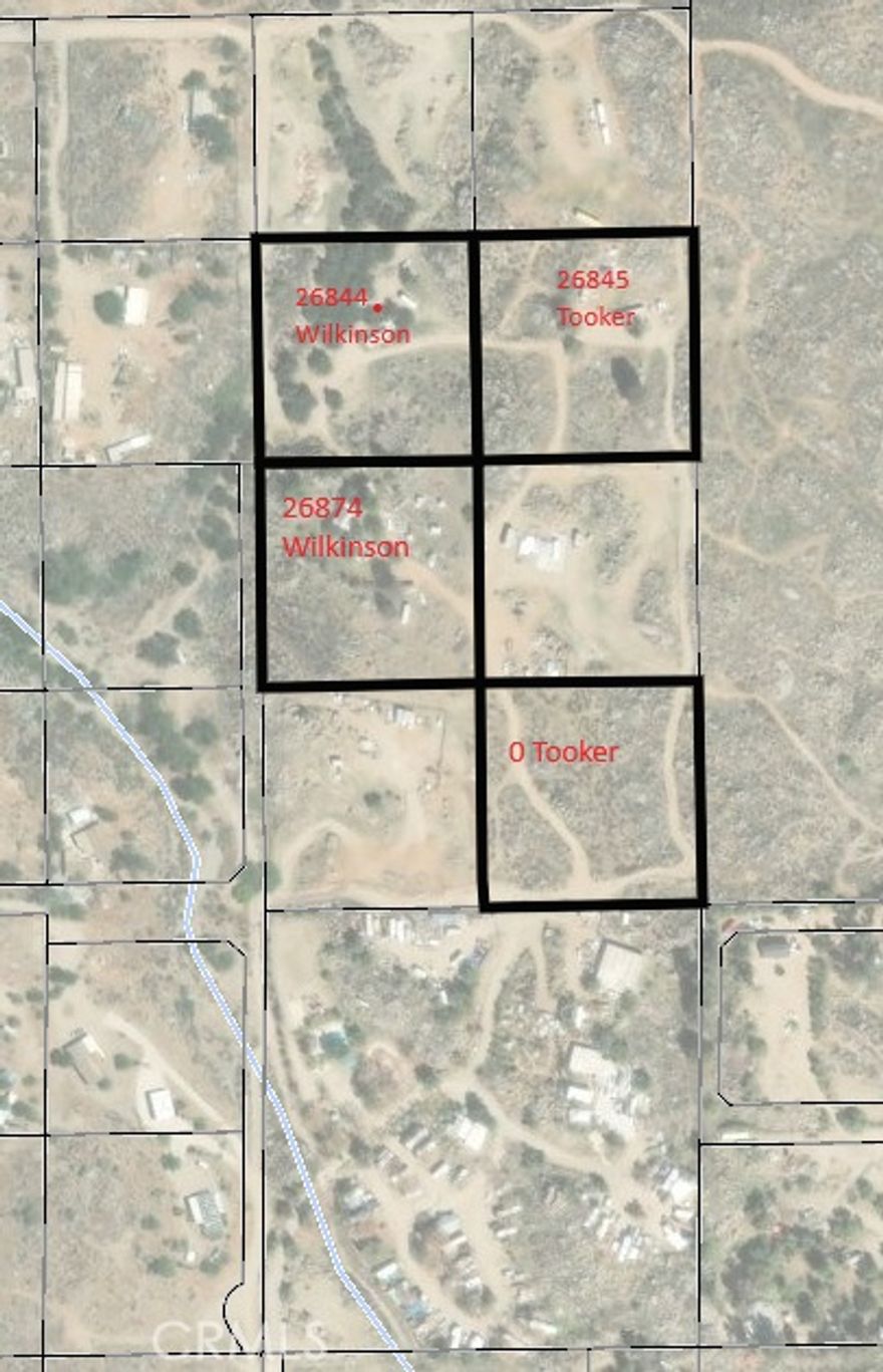 This property is ~2.5 acres of land, currently with a mobile home on it; however the mobile home is no longer habitable. The property has a water well and a septic system. Electrcity currently comes from the 26844 Wilkinson lot. This property offers rural living, opportunities for building and developing, agriculture, and plenty of space to bring your vision to fruition. This is one of four properties being offered and can be purchased individually, or along with any of the other three properties if desired. For reference, the additional property addresses are: 26844 Wilkinson, 26845 Tooker and 0 Tooker.  Collectively, the properties are ~10 acres.