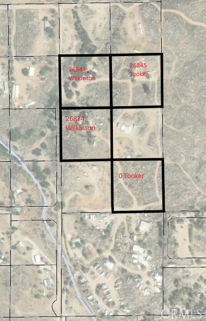This property is ~2.5 acres of land, currently with a mobile home on it; however the mobile home is no longer habitable. The property has a water well and a septic system. Electrcity currently comes from the 26844 Wilkinson lot. This property offers rural living, opportunities for building and developing, agriculture, and plenty of space to bring your vision to fruition. This is one of four properties being offered and can be purchased individually, or along with any of the other three properties if desired. For reference, the additional property addresses are: 26844 Wilkinson, 26845 Tooker and 0 Tooker. Collectively, the properties are ~10 acres.