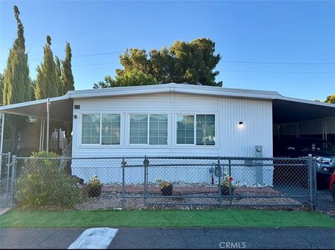 Photo of 22601 Bear Valley Road #63, Apple Valley, CA 92308 (MLS # HD25262814)