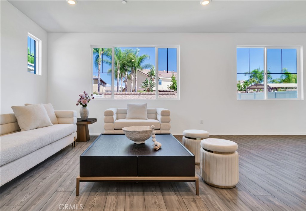 Buid by Meritage Homes in 2022! Upgraded Wall Panel! New Electricity Smart Toilets! One Bedroom Downstairs and Pool-size backyard! This Menifee home offers 2,900 sq. ft. of modern living on a 6,286 sq. ft. lot with 5 bedrooms and 3 full baths, each featuring high-tech electric smart toilets. The open floor plan highlights upgraded modern wall panels, a sleek kitchen with walk-in pantry, and a spacious primary suite with spacious walk-in closet. 12 leased solar panels adds energy efficiency, while the pool-size backyard is ready for your personal touch. Ideally located near I-215, shopping at Target, Kohl’s, and Newport Plaza retail/dining, and within the Menifee Union School District. The city boasts 48 parks, a new community center in progress, sports complexes, and the Menifee Global Medical Center, offering a safe and family-friendly environment with plenty of recreation and convenience. Don’t miss this opportunity to own this home in the desirable neighborhood!