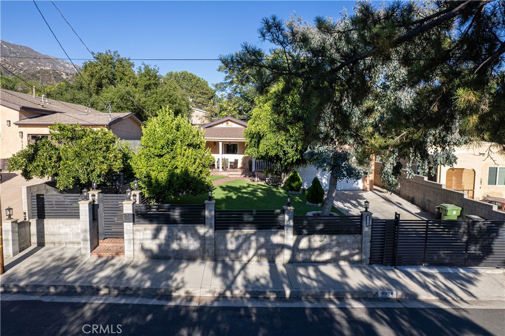 Welcome to this freshly remodeled charming single-story home nestled in the highly desirable Tujunga neighborhood!
This beautiful residence boasts a brand-new roof, new windows, and an entrance door that beautifully blends modern style with timeless classic design.
The property is fully gated with new gates, including a front gate that operates with a convenient code lock for added security and privacy. For additional peace of mind, the home is equipped with security cameras strategically placed around the perimeter—enhancing safety for you and your loved ones.
A classic-style front porch offers a shaded retreat from the sun—perfect for relaxing outdoors while staying cool and comfortable.
Inside, you’ll find a bright and spacious living area filled with natural light and a versatile floor plan designed for comfortable everyday living and entertaining. The generously sized kitchen is well-appointed with ample cabinetry, two stoves, two sinks, a dishwasher, and a refrigerator—ideal for preparing meals for family or hosting gatherings.
The master bedroom enjoys excellent daylight, creating a warm and inviting atmosphere throughout the day.
The home comes mostly furnished, including a fridge, washer and dryer in excellent condition, and the owner is leaving gym equipment for added convenience (Please see inclusions below).
Step outside to a meticulously maintained front and backyard filled with fruit trees and lush plants, offering a serene and private setting. The backyard also features back patio furniture, a gazebo, and ample space for gatherings, events, and quality family time. To make outdoor living even easier, the owner will pay for gardener services bi-weekly to maintain the yard’s pristine condition.
Additional highlights include a 3-car attached garage providing generous parking and storage space. Conveniently located just minutes from Foothill Boulevard, this home offers easy access to shopping, dining, and local amenities while enjoying the peaceful atmosphere of the foothills.
Experience the perfect blend of comfort, style, and community in this move-in ready home—schedule your private tour today!