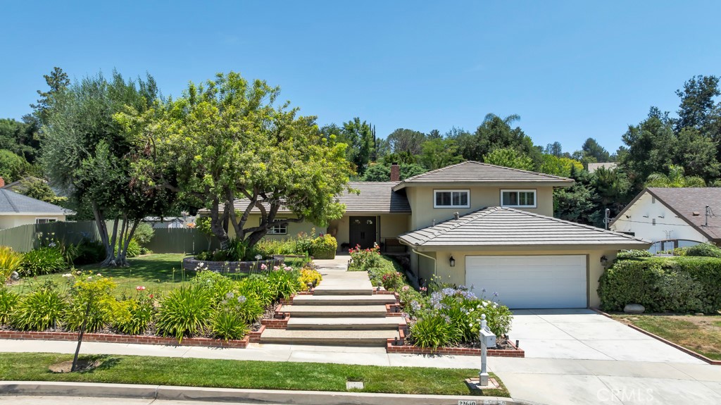 Welcome to 22640 Jameson Drive...an extraordinary five-bedroom, three-bathroom well thought out split-level home, perfectly situated in the highly coveted Mulwood subdivision of Calabasas. Boasting 2,867 square feet of living space on an expansive 18,976 square foot lot—one of the largest parcels in Mulwood—this home is thoughtfully designed for both comfort, style and entertaining all your guests! The home’s inviting light and bright layout offers a formal living room with fireplace and doors leading to the backyard, a separate family room with its own fireplace and yard access, and a stylish formal dining room ideal for special occasions.
Culinary enthusiasts will be delighted by the beautifully remodeled chef’s kitchen, showcasing luxurious stone countertops, abundant cabinetry, a walk-in pantry, charming breakfast nook, built-in wine rack, and a sprawling center island ideal for both entertaining and everyday family life. The high-end appliance package includes a Thor gas range with double oven, Miele dishwasher, LG Studio refrigerator, and more—making this a dream space for home chefs and entertainers alike.
Step outside to enjoy your private park-like oasis complete with a sparkling pool, large grassy yard, fire pit, additional grassy side yard, mature fruit trees, and plenty of space for outdoor living, entertaining or possibly adding an ADU/Guest House or sport court! Additional features include recessed lighting, skylights, an attached two-car garage with direct entry, and a flexible split-level floor plan perfect for multi-generational living.
Just moments away from top-rated Las Virgenes schools—including Chaparral Elementary, A.C. Stelle Middle School, and Calabasas High—this home is also conveniently close to Gelson’s, Bristol Farms, The Commons at Calabasas, Calabasas Country Club, Calabasas Swim and Tennis Center, The Village, Costco, Trader Joes and Westfield Topanga. Even the beaches of Malibu and Santa Monica are within easy reach! This is a rare opportunity to own an unforgettable property in one of Calabasas’ most desirable neighborhoods. Act fast—homes like this don’t come on the market often and sell quickly!