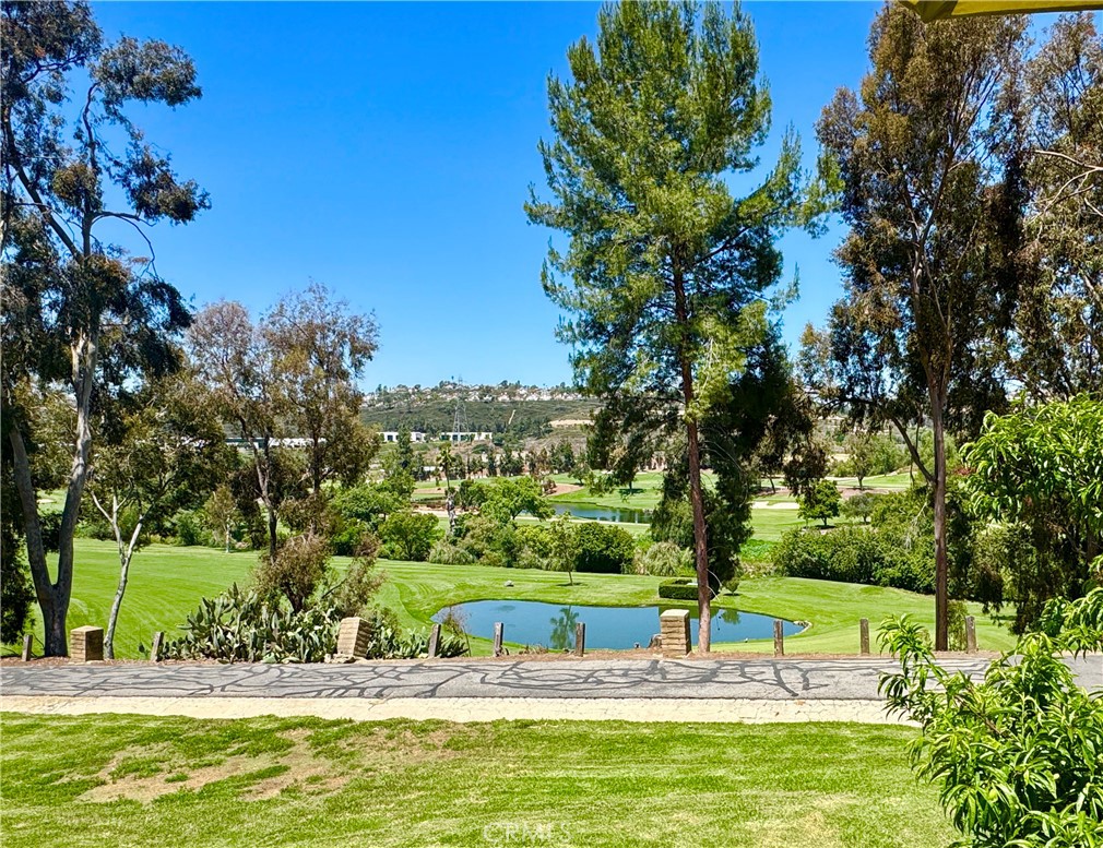 Welcome to this stunning single family home with golf course view nestled in the hills of the sought-after community of La Mancha in Mission Viejo. This home features 4 bedrooms, 3 bathrooms, 3 car parking (2-car garage, + an assigned parking spot). The property provides exceptional privacy and boasts breathtaking golf course and sunset views. Upon entering, you are greeted by a spacious living area with cathedral ceilings and new luxury vinyl flooring. Cozy up by the fireplace and enjoy the stunning views from the comfort of your home. The open-concept layout seamlessly connects the living area to the dining room and kitchen, which features ample cabinetry, brand new marble counters and custom island table. The living room provides easy access to the balcony, perfect for taking in the fantastic views or having an evening BBQ. The downstairs area includes a guest room complete with a full bathroom, as well as a separate family room with fireplace and private interior patio and backyard view patio—perfect for visitors, care takers or possibly separate living quarters for a renter? Upstairs, you'll find three additional bedrooms, including the primary bedroom with an en-suite bathroom with new marble counters, dual sink vanity and spacious walk-in closet. Both secondary bedrooms are bright and filled with natural light, featuring oversized closets and share a guest bathroom with new marble counters. La Mancha is located next to Mission Viejo Country club and offers HOA pool access, lots of serene walking paths, easy access to the freeway and is just a 5-minute drive from Saddleback College and Mission Viejo Mall and 20 minutes to the beach! This home combines upgraded amenities with an unbeatable location and views, making it a perfect choice for your next home sweet home.