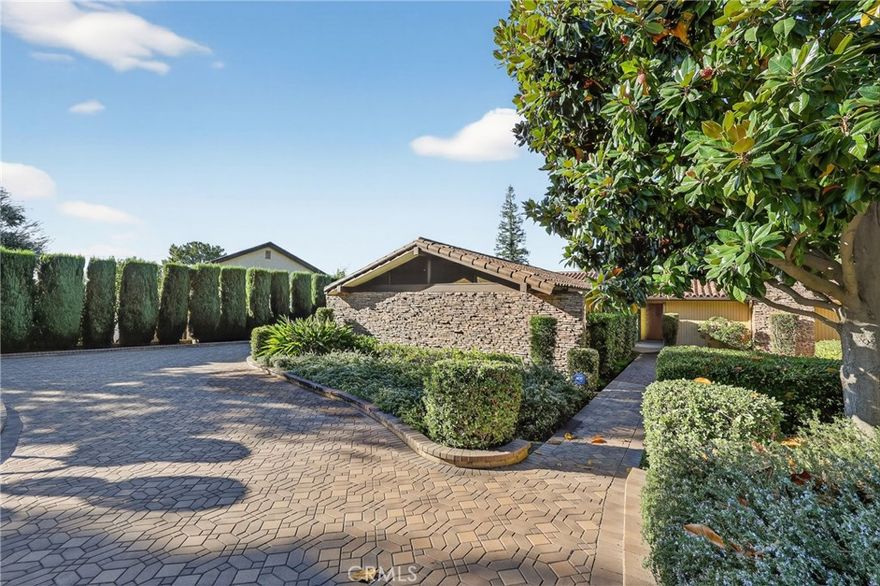 Nestled in the highly sought-after community of San Antonio Heights, this single level mid-century inspired home offers serenity, privacy, and breathtaking natural surroundings. As you approach down the private paved driveway, you're immediately embraced by lush greenery and tranquil atmosphere. The exterior showcases a modern architectural feel with striking lines and features.

Inside the sprawling layout boasts fresh neutral tones, designed for effortless entertaining and everyday comfort. The formal entry leads to the oversized living room with an elegant slump stone fireplace, and wall of glass overlooking the private courtyard. The family room is a stunning space, where expansive windows embrace natural light and frame views of the picturesque yard.  Just a glance away, the kitchen features an abundance of granite counters, and breakfast bar flowing seamlessly into the main living area, perfect for staying connected while hosting. Enjoy beautiful natural travertine flooring throughout, a breakfast nook, and an adjacent formal dining room, designed to accommodate both large parties, or intimate gatherings.



The primary suite has large glass sliding doors leading to a private lattice covered patio, and en suite containing a spacious glass enclosed walk-in tub/shower, displaying views of the private outdoor greenery.  The dual-sink vanity and spacious walk in closet complete this tranquil space. The secondary bedrooms feature an oversized layout, warm wood flooring, and mirrored wardrobes, and the 4th bedroom is currently used as an office with no closet.                                                             



The laundry room includes abundant linen storage, a utility sink, and convenient access to the home’s exterior.

Outdoors, this expansive lot continues to impress—surrounded by a variety of mature trees, lush landscaping, and ample usable space for relaxing or entertaining. Wander down to your private, pool with slate surround, perfectly positioned amongst the majestic trees and greenery, for a resort-like feel.  Continue through the secret garden even further, to find a green house/ garden shed, covered patio, and a sizeable private orchard, backing up to the tranquil wooded ravine.

This exclusive home and grounds with 2016 updated roof and interior is a dream come true, making it the perfect place to call home!