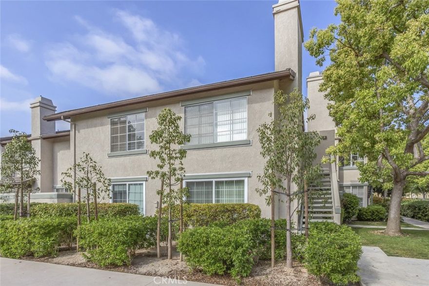 Beautifully upgraded, single-level, upstairs, end-unit condo available in the serene Columbia Square community. This home offers modern amenities and a prime location within walking distance to shopping, restaurants, and the University. The interior features contemporary grey laminate flooring throughout the living room, dining room, hallway, and bedroom. The kitchen and bathroom have been updated with solid surface countertops, modern cabinetry, and natural stone accents. The kitchen is equipped with stainless steel appliances, including a refrigerator, built-in microwave, and gas range. An enclosed laundry room, located just off the kitchen, includes a full-size washer and dryer. The unit also provides ample storage space. Enjoy relaxing on your private balcony, which offers views of lush green space, a basketball court, a playground, a volleyball court, and a gated pool and spa. The property includes two covered, side-by-side parking spaces conveniently located near the unit, both with additional storage lockers. Don't miss out on this beautiful home!