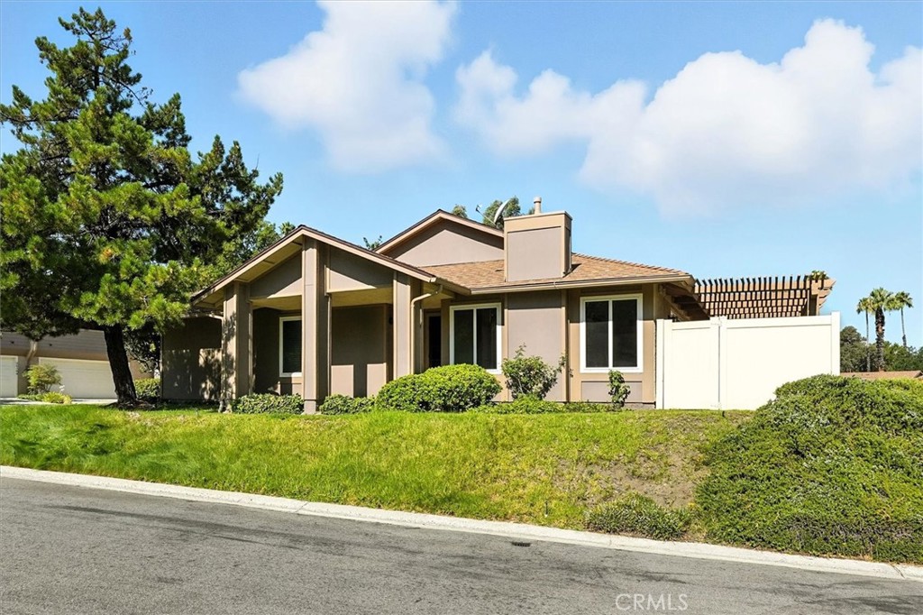 Discover this charming 2-bedroom, 2-bath home with an attached 2-car garage, ideally situated on a beautiful lot overlooking the greenbelt and lush mature landscaping. Step into the bright, spacious living room with sliding glass doors that open to a large patio—perfect for relaxing while enjoying tranquil views. The kitchen offers ample cabinetry and brand-new appliances, including a stove, microwave, and dishwasher. The adjoining dining area also features sliding glass doors to the patio, creating an easy indoor-outdoor flow. The primary suite boasts a walk-in closet, and a separate commode and shower area. Recent upgrades include exterior paint (2020), a new roof (2023), new patio roof (2021), dual-pane windows and sliding glass doors, newer HVAC system, newer garage door opener, and the brand-new kitchen appliances. Located in the Newhall area of Santa Clarita, Scenic Hills is a gated community set on 72 landscaped acres. Enjoy resort-style amenities: pool, spa, weight room, clubhouse with kitchen, showers and sauna, 9-hole golf course, tennis courts, and expansive greenbelts throughout and the HOA maintains the front lawn and landscape.