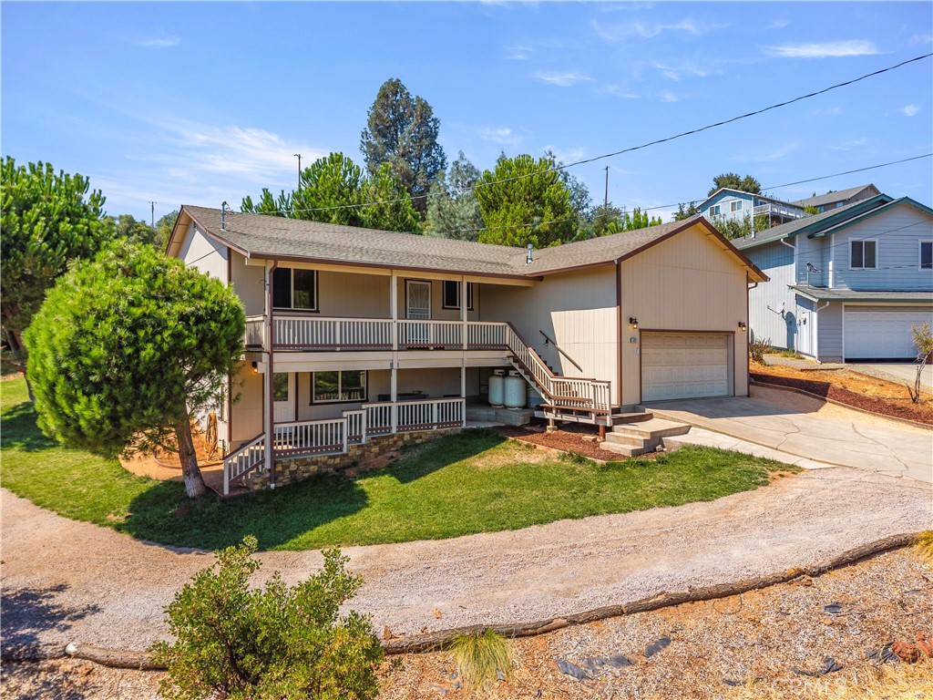 Custom Home in Kelseyville Riviera! Pride of ownership shows throughout this updated and remodeled 3 Bedroom/2 Bathroom PLUS a bonus room with a separate entrance. The main floor features a peek-a-boo lake view, an open-concept living/dining room, and kitchen with stainless steel appliances. Down the hallway is the guest bathroom, the guest bedrooms, and the primary suite. The living room has a spiral staircase to the downstairs family/game room and a half bath with its own entrance. Updates include new floors, paint, a finished shed, and extensive cement work! Through the dining room, the backyard oasis features a sprinkler system on timer, a deck, patio area, outdoor bar, above-ground pool, and a finished shed- perfect place for an office, art room or hobby room. The side yard and driveway offer a place for RV or boat parking! Even the basement had extensive cement work done for unincorporated storage. Great location close to the elementary school, shopping center, coffee shops, and restaurants!