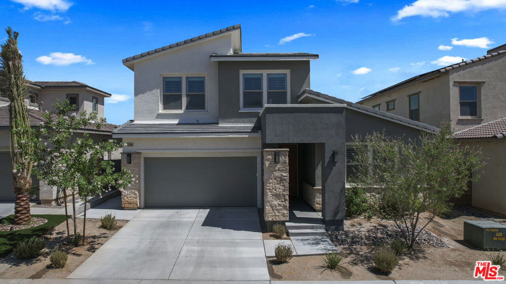 This contemporary home boasts over 2400 square feet of Luxurious living space. It's the perfect blend of Modern and Elegance and Eco-Friendly features. This popular plan 5 model is situated in the very desireable "Sage" community in a pristine and quiet location. The chef inspired kitchen is the Centerpiece of this beautiful home and features an impressive 50 square foot island with seating for six. A spacious great room with Custom shelving and Custom stone decorative fireplace, and dining room flow effortlessly out to an oversized covered patio and private backyard. This well planned floor plan features first floor dual primary suites, each with beautiful ensuite baths. A separate first floor powder room, sizeable laundry room and abundant storage space allow for ease of living. The second floor is bright and airy and includes two additional bedrooms providing extra space for guests. Both bedrooms enjoy easy access to a well appointed full bath. Attractive finishes include Quartz surfaces, stylish backsplash accents, custom shutters and so much more. Eco-friendly features include OWNED solar panels, tankless water heater and energy efficient Milgard windows. Conveniently located near shopping, dining, and major highway routes. This home offers the perfect balance of tranquility and accessibility. Sage residents enjoy resort style living that includes a gated entry system, refreshing pool, club house, fully stocked gym and yoga lawn.