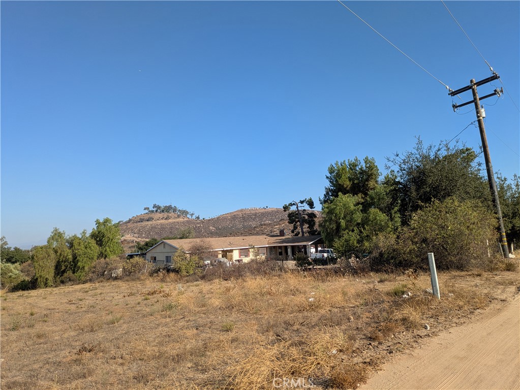 INVESTMENT OPPORTUNITY !! ATTENTION DEVELOPERS !! MURRIETA near shopping at Costco, Vista Murrieta High School and EZ Access to Hwy 215.
1.99 ACRES in the HEART of current developments of Multi-Family Dwellings! LOCATION, LOCATION, LOCATION! DIRECTLY ON THE CORNER WITH A NEW TRAFFIC SIGNAL ON THE EXPANDED CLINTON KEITH ROAD. ON THE CORNER OF ARENDT LANE X CLINTON KEITH. BETWEEN SIGNALS AT WHITEWOOD AND MENIFEE RD. New Developments all around the area in progress and in Murrieta Planning Dept awaiting approval. Current Developer nearby will be paving the street directly in front of this property. There is a Custom Home on the property that could be lived in or used for Construction Office ? or Rental ? Or ?, while you are in Planning. Don't let this one get away from you!! Nearby properties are also available. Currently zoned RO2, for 6-10 Units per acre.