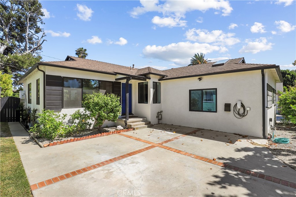 Proudly introducing this beautifully updated single-family residence with a permitted Junior ADU in one of Culver City’s most desirable neighborhoods. The main residence features 3 spacious bedrooms and a bonus room, and 2.5 bathrooms, highlighted by stunning oak wood flooring throughout the home. Enjoy an open-concept layout that seamlessly blends the living room, dining area, and chef-inspired kitchen—complete with a large quartz island with bar seating, subway tile backsplash, floating shelves, a pull out drawer pantry and cabinets, and newer stainless steel appliances. The primary suite offers comfort and functionality with dual closets (including a walk-in), French doors leading to the backyard, and a luxurious en-suite bathroom featuring a glass-enclosed shower, designer soaking tub, and a rainfall showerhead. Other features include spacious secondary bedrooms, additional FLEX room that could be a bedroom or office and Tesla charger in 2 car driveway! The attached Junior ADU with separate address, built in 2023, offers a modern living space with its own kitchen, full bathroom, skylight, recessed lighting, built in AC/heater unit, and separate electrical/ water service—ideal for guests, rental income, or a home office. Outside provides your private backyard oasis with a PEX finished patio and a newly done modern landscaping that features a lush garden filled with mature fruit trees and beautiful herb garden —including fig, pomegranate, apricot, peach, passion fruit, citrus trees, lemon, orange and abundant lavender and rosemary bushes with raised garden beds for grow-your-own vegetable garden. A separate shed provides additional storage. Located in the sought-after award-winning Culver City School District and near El Marino Language School, you are also moments away from Sony Studios, Google Campus, Silicon Beach, Westfield Mall , Fox Hills, Downtown Culver City, Playa Vista , Whole Foods, Traders Joe's and much more. This tree-lined neighborhood with charming Magnolia trees offers an unbeatable combination of quality lifestyle and convenience.