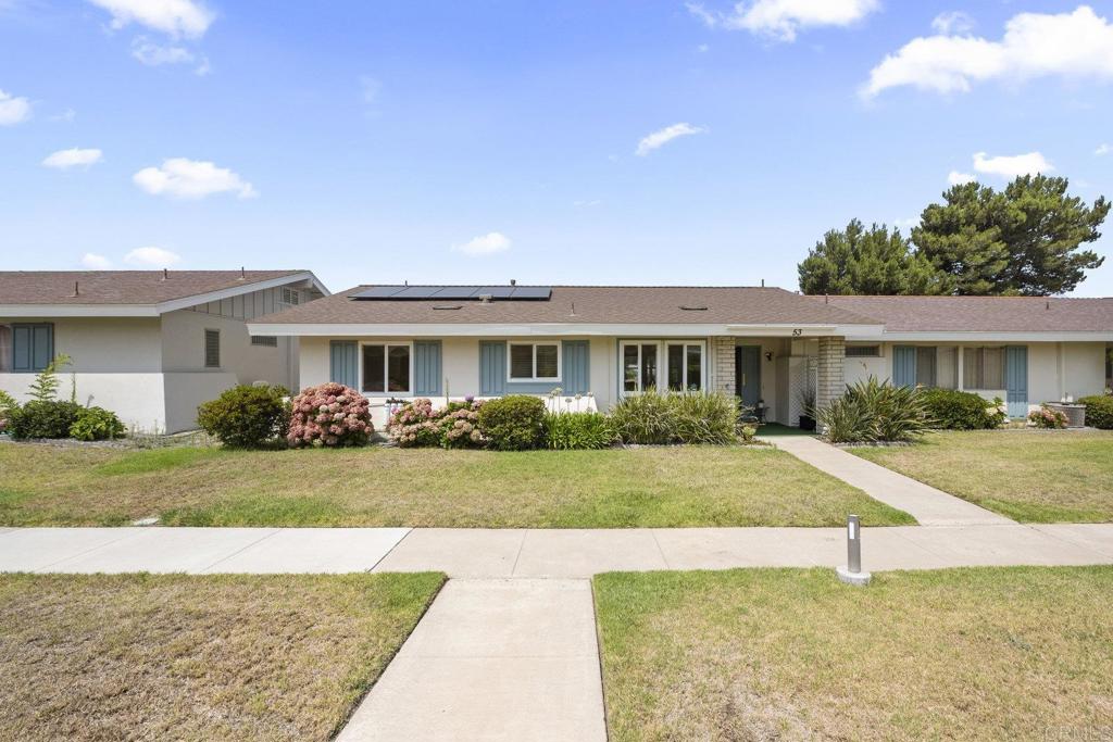 Come discover this beautifully upgraded home in the sought-after Oceana VI community! This single story 2 bedroom, 2 bath, 1028 square foot home plus a fully enclosed insulated sunroom is located in a quiet and peaceful 55+ community. Walking into the home you'll instantly be welcomed by tons of natural lighting filling the entire property. The living room has gorgeous views of the greenery and nature outside with ample room to relax and entertain friends and family. Enjoy preparing your favorite meal in the updated kitchen with new range, dishwasher and plenty of counter and cabinet space. Unwind after a long day, in the completely remodeled primary bathroom with custom tile work and glass walk-in shower. This move-in ready and energy efficient property features 20 owned solar panels with a completely new fully tear off roof, electric car charging station, dual mode HVAC system with mini/split, new electric water heater with recirculating pump for on-demand hot water and electrical panel all to help you conserve and save money on your electricity bills. Enjoy peace of mind with a whole-home water filtrations system and the property has been re-piped to avoid any plumbing pipe issues in the home. HOA amenities include the clubhouse, large community pool, rec room, cable TV, sewer, trash and water. Minutes away from shopping, dining, entertainment, beaches and everything that the Oceana lifestyle has to offer!