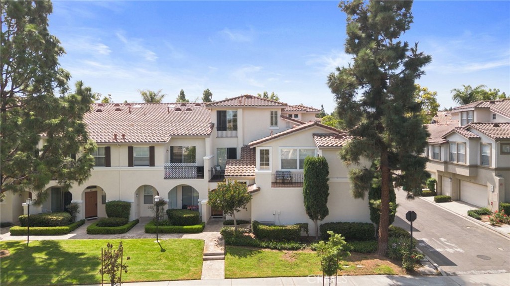 Welcome to this bright and inviting condo located in the highly sought-after gated community of Oak Park, Irvine. With its Spanish-inspired architecture, red-tile rooflines, and lushly landscaped pathways, this residence blends timeless charm with modern updates. Step inside to find a tri-level condo with recessed lighting and upgraded wood-style flooring that flows seamlessly throughout the main level. The spacious living room is perfect for both relaxing and entertaining, while the adjacent dining area and kitchen create an effortless flow. The kitchen features crisp white cabinetry, tile countertops, a stainless-steel refrigerator, and a full suite of appliances, making meal prep a breeze. Enjoy the private balcony, a perfect spot for morning coffee or evening unwinding. Upstairs the primary suite offers a peaceful retreat with peekaboo mountain views, abundant natural light, dual vanities, and a large walk-in closet. Recent upgrades include washer/dryer appliances, water heater (2023), recessed lighting, water shut off valve, plantation shutters, and bathroom fixtures. The attached 2-car garage offers ample storage space as well. Enjoy resort-style amenities including pools, spas, basketball court, playgrounds, and walking trails. Conveniently located near Oak Creek Shopping Center, Irvine Spectrum, The District, John Wayne Airport, and top-rated Irvine schools. Easy access to I-5 and 405 freeways. To top it off, this property has NO MELLO-ROOS and one of the lowest HOA in the city. A fantastic opportunity to own in one of Irvine’s most sought-after neighborhoods. Property qualifies for 3% Down, No PMI, $20,000 for closing or rate buy down!
