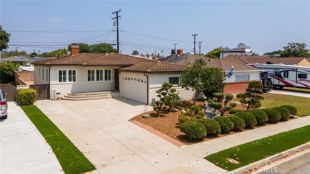Welcome to 16015 Arcturus Ave, a beautiful three-bedroom, two bath home located in one of the best areas of Gardena, near El Camino College. Features include a large open living room and dining room with original hard wood floors and a wood burning fireplace. The galley kitchen has lots of cabinet space, a Viking stove and newer stainless-steel refrigerator and dishwasher. Off the kitchen is the laundry room with included Speed Queen washer and dryer. There is a primary bedroom with an attached 3/4 bathroom and two additional good size bedrooms and a second full bathroom. The front and back yards are meticulously maintained, and gardening is included in the lease price. All this plus a two-car-attached garage, recessed lighting throughout the house, forced heating and air conditioning make this a house to call home.