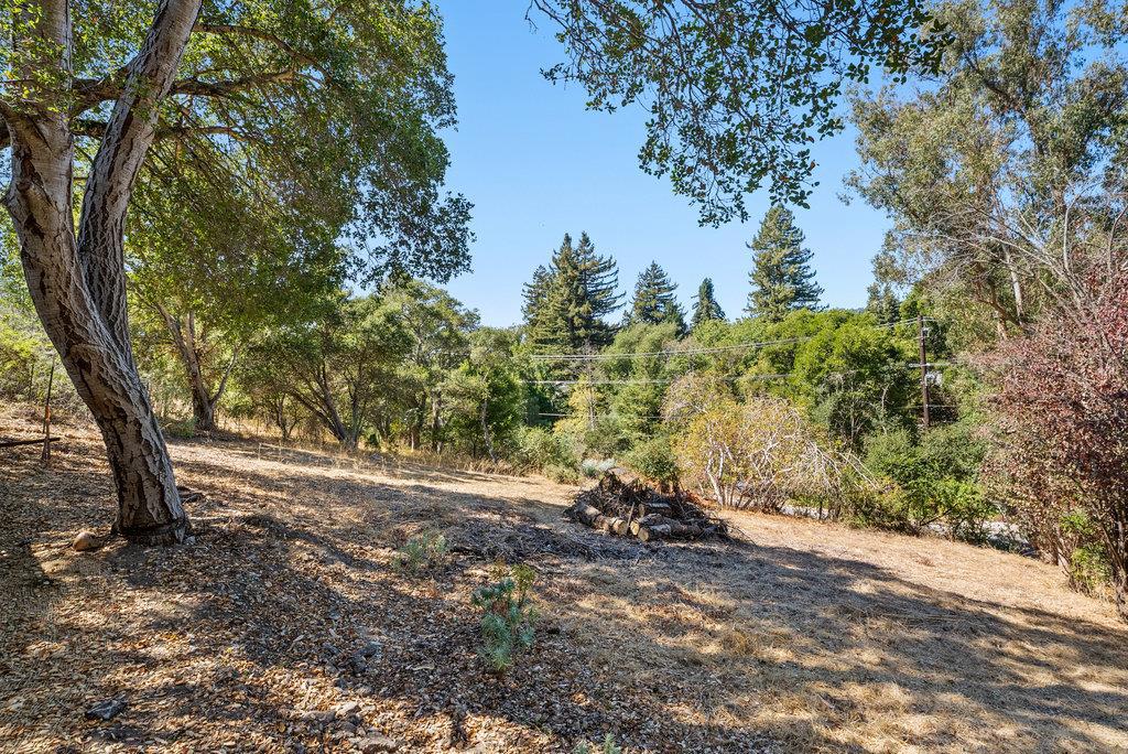 This conforming R-1-5 zoned lot offers a rare chance to build in one of Santa Cruz's most desirable neighborhoods. The gently sloped (under 30% slope), west-facing parcel is mostly cleared and sits on Santa Margarita sandstone, providing excellent foundation conditions. Enjoy beautiful Pogonip views and spectacular sunsets. Located in the heart of Midtown, the property is just minutes from DeLaveaga Park and Golf Course, Shoppers Corner, The Buttery, and the beach. Plus, it offers quick freeway access for commuters. All utilities are available at the Market Street frontage, streamlining the development process. Whether you're an investor, builder, or future homeowner looking to create a multi-unit compound or single-family home, this property delivers location, flexibility, and potential. Buyers to investigate all information. Boundary overlay is approximate.