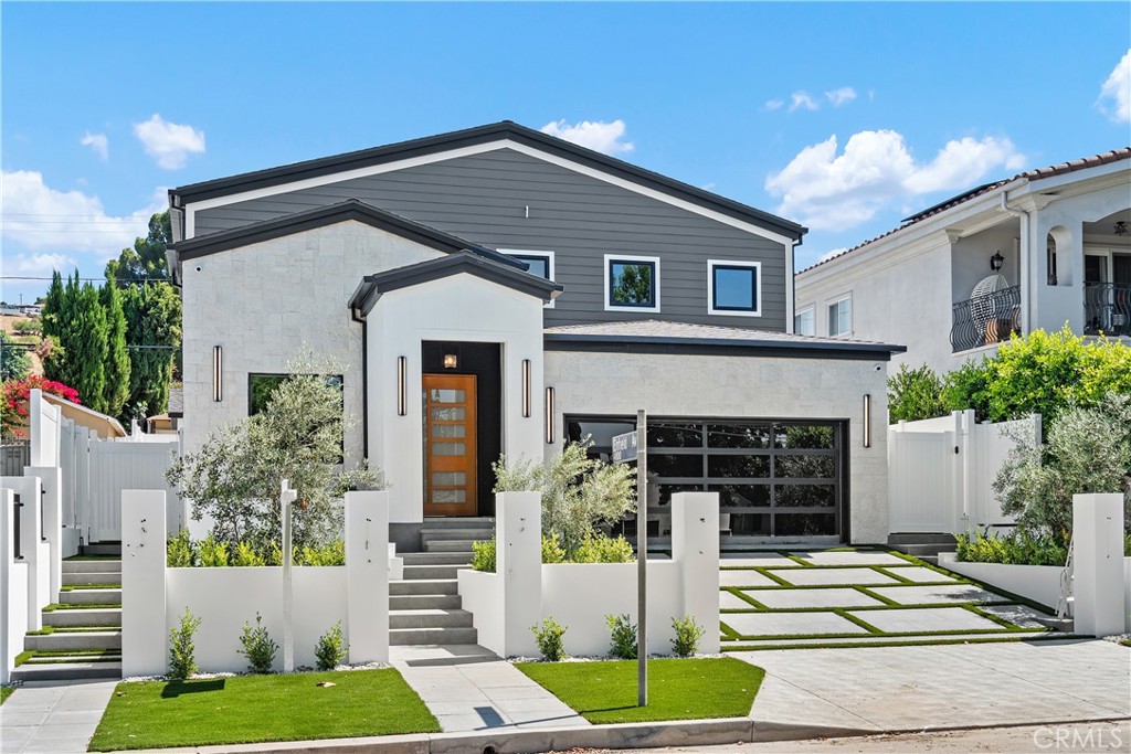 Welcome to this stunning, newly constructed smart home located south of the Boulevard in prime Encino. This thoughtfully designed two-story residence blends high-tech convenience with elevated style, featuring a 4-bedroom, 3-bath main home (over 2,700 sq ft) and an impressive 1-bedroom, 1-bath ADU (approx. 530 sq ft)—ideal for extended family, guests, or rental income.
Inside, a bright, open floor plan centers around a spacious kitchen with a large island that seamlessly connects to the living areas. Multi-panel glass doors fully retract to extend the living space outdoors, where a built-in BBQ and outdoor refrigerator create the perfect setting for entertaining and embracing the Southern California lifestyle.
Upstairs, the luxurious primary suite is a true retreat, featuring a fully finished walk-in closet and a spa-inspired bathroom adorned with striking black and white marble. It includes a large walk-in rain shower, a deep soaking tub, and elegant dual vanities, all designed for comfort and style. Step outside to your private balcony.
Two additional upstairs bedrooms and a first-floor bedroom provide flexibility for guests or a home office, while the upstairs laundry room adds everyday convenience.
This all-electric, solar-powered smart home is equipped with Alexa-enabled voice control, Lutron Caseta smart lighting, a Unifi enterprise-grade WiFi system, and a high-performance audio setup featuring 4 Sonos amplifiers, 8 Sonance interior speakers, and a Sonance 6.0 exterior sound system. Front and rear landscaping features drought-tolerant plants, offering both beauty and sustainability.
The ADU could be separately gated for full privacy, making it an excellent option for rental, multi-generational living, or a dedicated studio. A gated driveway will be completed by close of escrow for added security and curb appeal. Professional Photo's coming soon