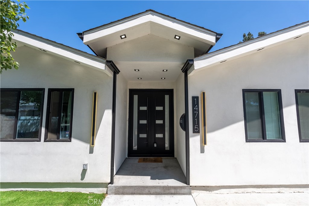 Welcome to this stunning Fully Remodeled Home with an ADU in the San Fernando Valley! Step into modern elegance with this beautifully remodeled 5-bedroom, 4.5-bath property, featuring two private primary suites and an open-concept floor plan perfect for family living and entertaining. The fully upgraded kitchen flows seamlessly into the living space, while sliding doors open to a spacious backyard oasis with turf, a shaded lounge, and an outdoor dining area. A brand-new attached ADU with its own entrance adds versatility for guests, extended family, or rental income. Enjoy upgrades throughout—vinyl fencing, recessed lighting, tankless water heater, and more—all just minutes from shops, grocery stores, and top-rated Van Nuys schools. This home truly has it all: style, space, and unbeatable convenience. Come see it and call it yours!
