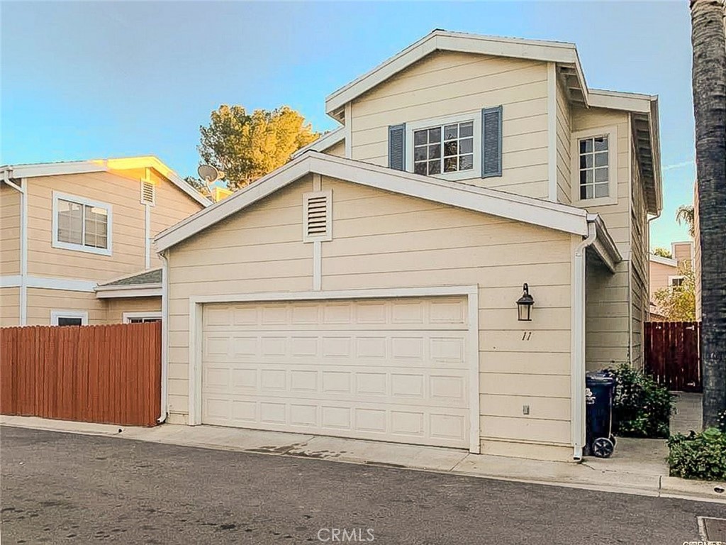 Well maintained gated community in the heart of Northridge within walking distance to CSUN and Granada Hills Charter High School! This 3 bedroom 2.5 bathroom detached townhouse with no shared walls features a bright and spacious floor plan with ample windows for natural lighting. The remodeled kitchen includes stainless steel appliances while the updated bathrooms and flooring add a modern touch. The generous sized living room offers a cozy fireplace and sliding door access to a cozy well maintained private patio- enjoy during the summertime! Additional highlights include a half bathroom downstairs, central AC and heat, large bedrooms with high vaulted ceilings and an attached 2 car garage with washer and dryer. Conveniently located near public transportation, parks, and the 118 freeway- this home combines comfort location and style in one desirable package!