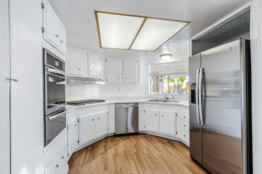 Welcome to this beautifully remodeled 2-bedroom, 2-bathroom home nestled in a family-friendly community of Silicon Valley Village. Thoughtfully updated throughout, this bright and airy home features two separate living rooms, offering plenty of space for relaxation or entertaining. This home boasts new carpeting in the bedrooms, fresh paint, and new modern appliances, giving it a fresh, move-in-ready feel. The kitchen is both functional and inviting, with crisp white cabinets and ample storage space to keep everything organized. The bedrooms are generously sized for comfort, and the primary suite includes a private bathroom with a relaxing tub. With abundant natural light and smart storage throughout, this home blends comfort and convenience in a welcoming neighborhood perfect for families. Community amenities include a clubhouse, playground, basketball courts, fitness center, game room, swimming pool, and spa.