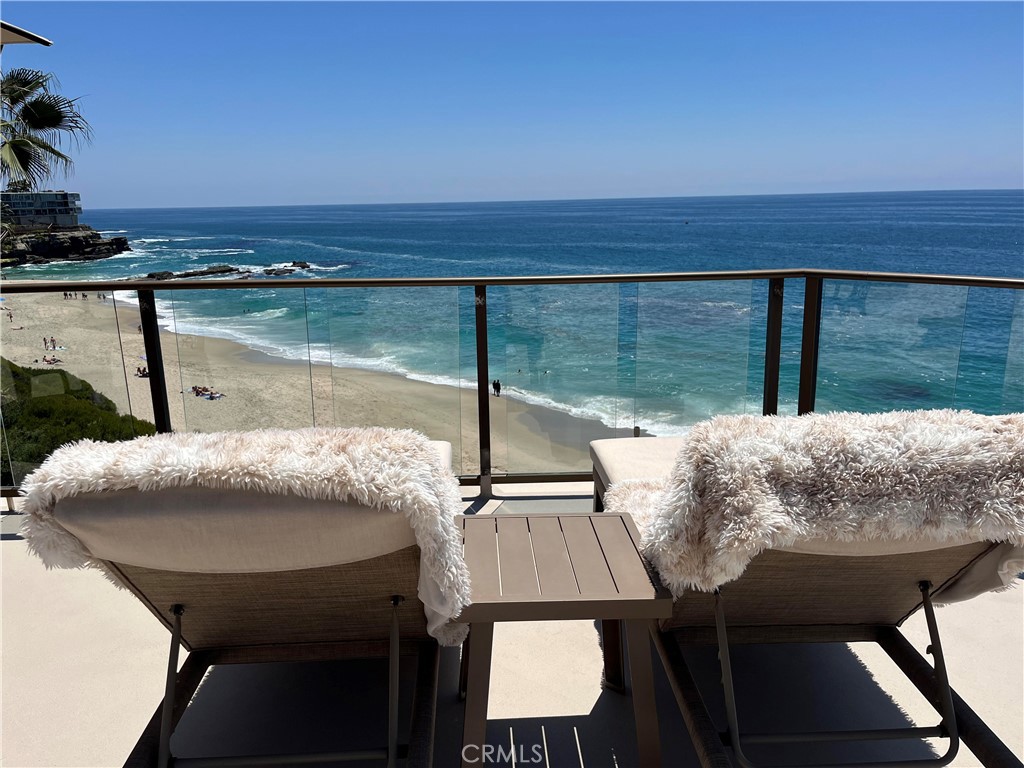 PRUDENT BUYERS UNDERSTAND THE VALUE OF LOCATION……THIS PROPERTY DELIVERS…. LOCATED ON THE SAND AT THE “THE LAGUNA ROYALE” THIS HOME PROVIDES A UNIQUE OPPORTUNITY TO ENJOY OCEANFRONT LIVING AT ARGUABLY ONE OF THE FINEST LOCATIONS IN THE WORD. ON YOUR BEACH DECK YOU CAN SPEND TIME PERCHED 70’ ABOVE THE SURF AND SAND OR USE YOUR PRIVATE GATED ACCSS TO COAST ROYALE BEACH. SNORKEL THE TABLE ROCK COVE TO THE SOUTH, OR STROLL NORTHBOUND TO THE MONTAGE RESORT… THIS HOME PROVIDES ENDLESS OPORTUNITIES TO ENJOY COASTAL LIVING AT IT’S BEST. COMPLETELY REMODELED FROM THE STUDS OUT AND THE FLOORS UP BY AN AWARD-WINNING DESIGNER. THIS HOME INCLUDES 2BR 2BA, 1150’ OF INTERIOR LIVING & A WHOPPING 2,000’ OF USABLE DECK SPACE JUST STEPS FROM YOUR BACK DOOR. OTHER SIGNIFICANT AMENITIES INCLUDE A DREAM KITCHEN FOR ANY CULLINARY AFFECTIONADO, FISHER & PIKEL 48” RANGE, DOUBLE DISHWASHERS AND BUILT IN REFRIGERATOR. INCLUDES CUSTOM DESIGNED BACKSPLASH, A GIANT FREE STANDING OCEAN WAVE QUARTZ PREP ISLAND WITH LOADS OF STORAGE SPAC. GENEROUS SURROUNDING COUNTERS ARE COMPRISED OF STATE-OF-THE-ART DEKTON STONE. THE BEVERAGE STATION INCORPORATES A MIELE HOT SERVE/COFFEE CENTER, MONOGRAM BEVERAGE COOLER AND AN ADDITIONAL BUILT IN PRECISION COOKING MICRO/CONVECTION OVEN. ONE OF THE MOST FASCINATING FEATURES OF THIS SPACE IS THE “JAR BAR” AN INGENOUS CREATION THAT PRESERVES ALL YOUR DRY GOODS BY A BEAUTIFUL INTEGRATED LIGHTED DISPLAY CAB. THE BATHROOMS INCLUDE JETTED TUB, TOTO WASHLETS AND DESIGNER ACCENTS. THE MASTER BEDROOM IS ADORNED WITH HAND SELECTED ARTISAN STONE AND THE FAMILY ROOM AND KITCHEN, WITH LEDGER STONE. BUILDING AMMENITIES INCLUDE ELEVATORS SERVICING ALL LEVELS, COMMUNITY OCEAN VIEW POOL, SPA & GYM, SUBTERRANEAN GARAGE, GUEST PARKING AND 24/7 SECURITY GUARD. THE ORIENTATION OF THIS HOME CAPTURES THE SUNSETS 365 DAYS OF THE YEAR, WEATHER PERMITTING. AS AN ADDED BONUS YOU HAVE FRONT ROW SEATS DURING THE WHALE MIGRATION SEASON AND PODS OF DOLPHINS FREQUENTING YOU BACK YARD ALL YEAR LONG.