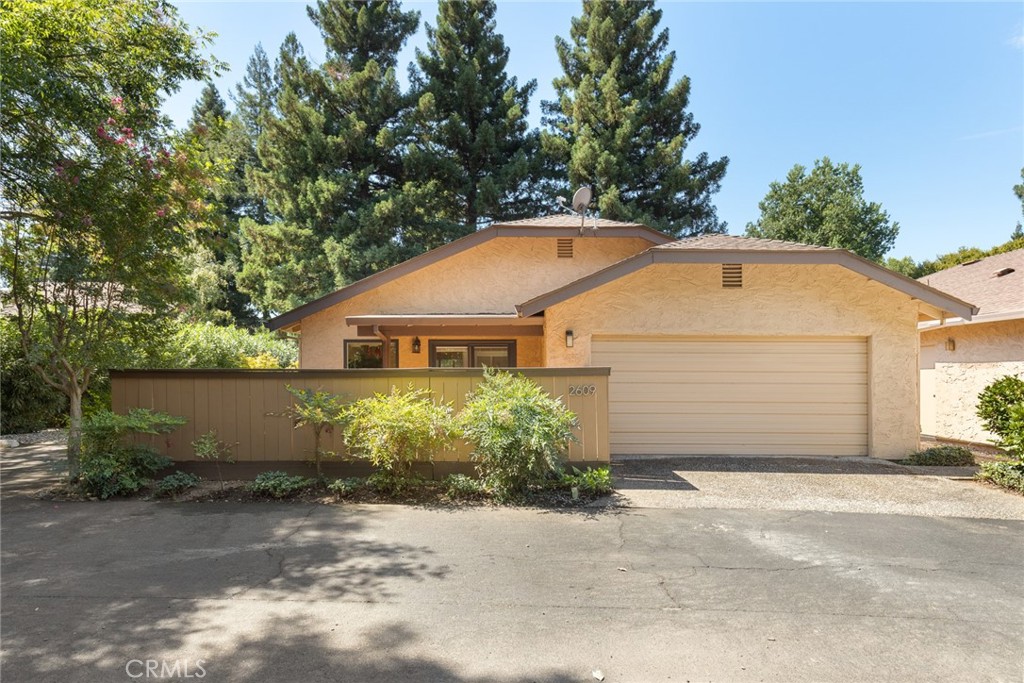 Just location in the complex!! Tucked away in the back of this ever popular neighborhood, this home is just a great place for relaxing on not 1 but 2 different patios !!! Large living room with vaulted ceilings, fireplace and open to dining room with beautiful chandeliers !!! This easy living kind of place has a bonus room that could be used as a 3rd bedroom, office or den. The possibilities are simply just endlesss !! Lots of storage, enjoy the grounds that are taken care of by the HOA, inground pool and all the amenities that are covered, including the roof !!!