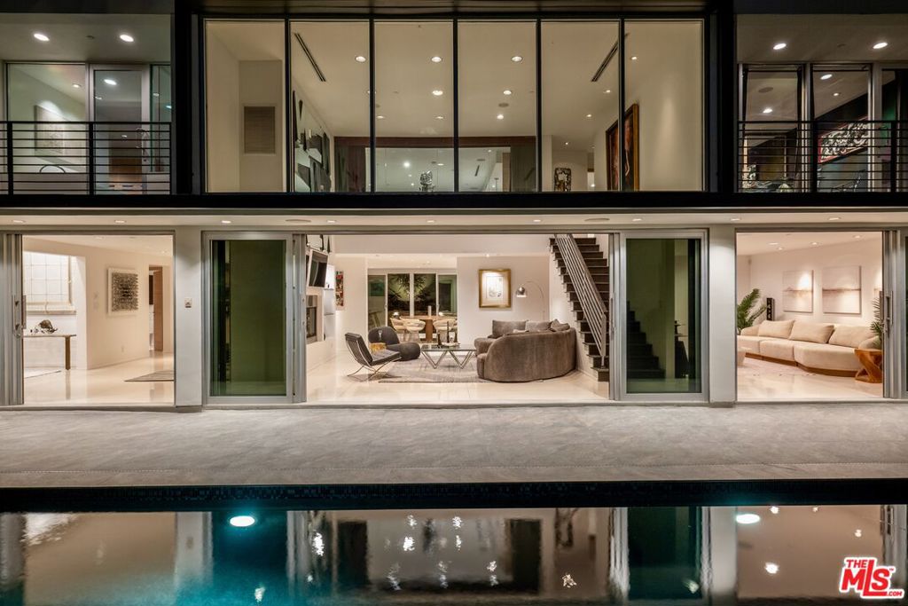 Perched on a rare gated flag lot along the iconic Sunset Plaza Drive in the heart of the Hollywood Hills, 1545 Sunset Plaza offers an unparalleled blend of privacy and modern elegance. Located just moments from the Sunset Strip, it provides easy access to premier shopping, fine dining, and vibrant nightlife, all while offering a serene retreat surrounded by lush greenery and majestic sunsets. This exclusive property strikes the perfect balance between city life convenience and tranquil seclusion, defining Los Angeles luxury living.Designed with custom Italian and European finishes, this home boasts an open layout that seamlessly fuses indoor and outdoor spaces. Expansive sliding glass doors, sleek terrazzo floors, and new wooden flooring throughout the bedrooms create a sophisticated yet inviting ambiance. The thoughtfully designed chef's kitchen features top-of-the-line appliances from Sub-Zero, Viking, Miele, and Bosch, catering to anyone who appreciates both effortless convenience and gourmet meals.An entertainer's dream, 1545 Sunset Plaza is ideal for hosting gatherings under the Sunset Plaza sky. The newly remodeled oversized pool and deck provide space for sun-soaked relaxation or lively events, while the extra-large guest house provides ample room for overnight guests. A motor court and three-car garage provides plenty of onsite parking. Evenings are heightened by breathtaking panoramic views of the LA skyline from the interiors and pool deck, showcasing stunning sunsets and a dazzling cityscape at night. With every detail designed for style and function, this property embodies the essence of elegance with an unforgettable allure!