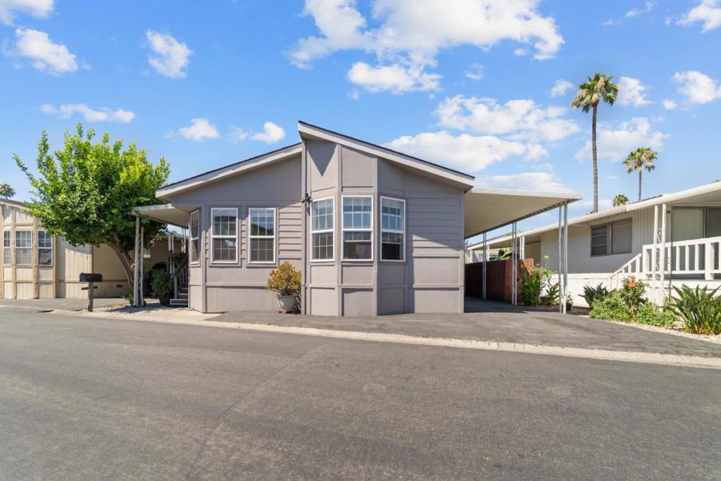 Welcome to this beautifully maintained home in the highly desirable Magic Sands Mobile Home Park! This spacious property offers 3 bedrooms, 2 bathrooms, and a den, perfect for a home office or additional living space. The home features high ceilings and a bright, open living room with windows for natural light. The kitchen includes a center island. Separate laundry room with a washer and dryer included. The backyard with entertaning lights system - making it a great space for relaxing. Convenient locations to freeways and shopping center.