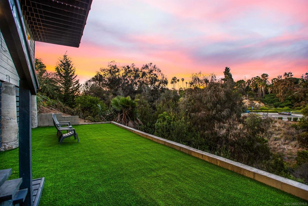 Welcome to 2685 Montclair—a beautifully renovated 3-bedroom, 2.5-bath home in the heart of North Park, blending modern style, generous space, and exceptional versatility. In addition to the three bedrooms, the home boasts two expansive bonus rooms—each approximately 400 sq. ft.—perfect for a home gym, office, media room, or guest quarters. The modern chef’s kitchen features marble countertops, stainless steel appliances (including Bosch double ovens), and a spacious pantry for ample storage. The entry level impresses with vaulted ceilings, a cozy gas fireplace, and an open-concept living and dining area that extends to a large balcony with serene canyon views overlooking Montclair Park. A charming nook off the living room offers a perfect play space or extra storage. The primary suite is a retreat of its own, showcasing a renovated en-suite bathroom with dual sinks, a walk-in shower, and a generous walk-in closet. Additional features include owned solar panels, air conditioning, and a prime location just a 10-minute walk to highly regarded McKinley Elementary. Ideally situated minutes from the 805 and 15 freeways, and close to markets, restaurants, parks, and entertainment venues. Only blocks from Balboa Park with its open spaces, museums, and the world-famous San Diego Zoo. This is a rare opportunity to enjoy comfortable, flexible living in one of San Diego’s most vibrant neighborhoods.