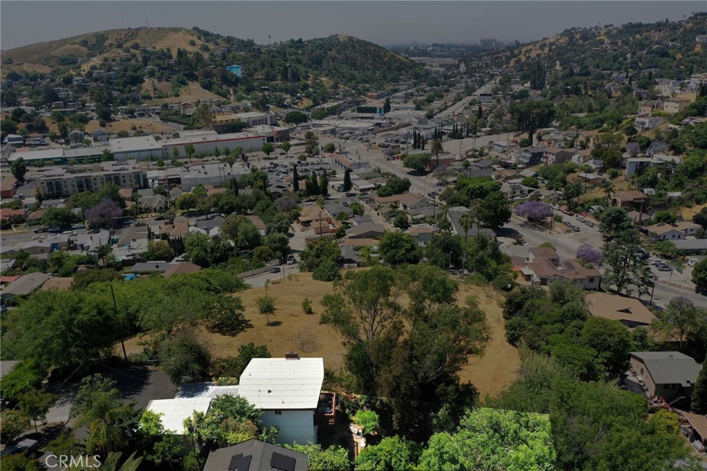 Explore the El Sereno–Monterey Hills area!
Enjoy the scenic drive up the hill, leading to the neighborhood’s only street that ends in a peaceful cul-de-sac.
This charming three-bedroom, two-bath home offers stunning views from nearly every room. The street-level entry opens to a spacious living area with hardwood floors, a cozy fireplace, and a balcony overlooking mature trees and city streets. The modern kitchen features brand-new cabinets, cork countertops, and tasteful updates throughout.
Descending from the living room, a staircase leads to the lower level, where you'll find three fully remodeled bedrooms and a stylish bath with a glass shower door. The laundry area is conveniently located beneath the stairs.
Additional highlights include:
- Freshly painted interior and exterior
- Mostly upgraded plumbing and electrical systems
- Elegant hardwood flooring and stairs
- New roof at garage with two-car garage with direct access near the main entry
Step outside and unwind in the spacious backyard, filled with fruit trees and mature landscaping—perfect for relaxing or entertaining.